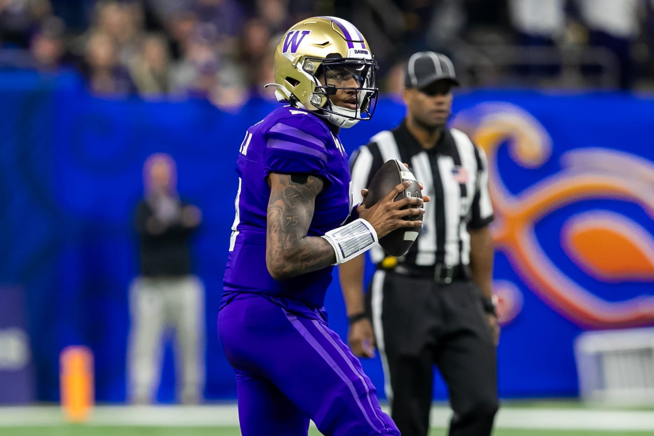 NEW ORLEANS, LA - JANUARY 01: Washington quarterback Michael Penix Jr. (9) searches for an open receiver during the Allstate Sugar Bowl playoff game between the Texas Longhorns and the Washington Huskies on Monday, January 1, 2024 at Caesars Superdome in New Orleans, LA. (Photo by Nick Tre. Smith/Icon Sportswire via Getty Images) NEW ORLEANS, LA - JANUARY 01: Washington quarterback Michael Penix Jr. (9) searches for an open receiver during the Allstate Sugar Bowl playoff game between the Texas Longhorns and the Washington Huskies on Monday, January 1, 2024 at Caesars Superdome in New Orleans, LA. (Photo by Nick Tre. Smith/Icon Sportswire via Getty Images)