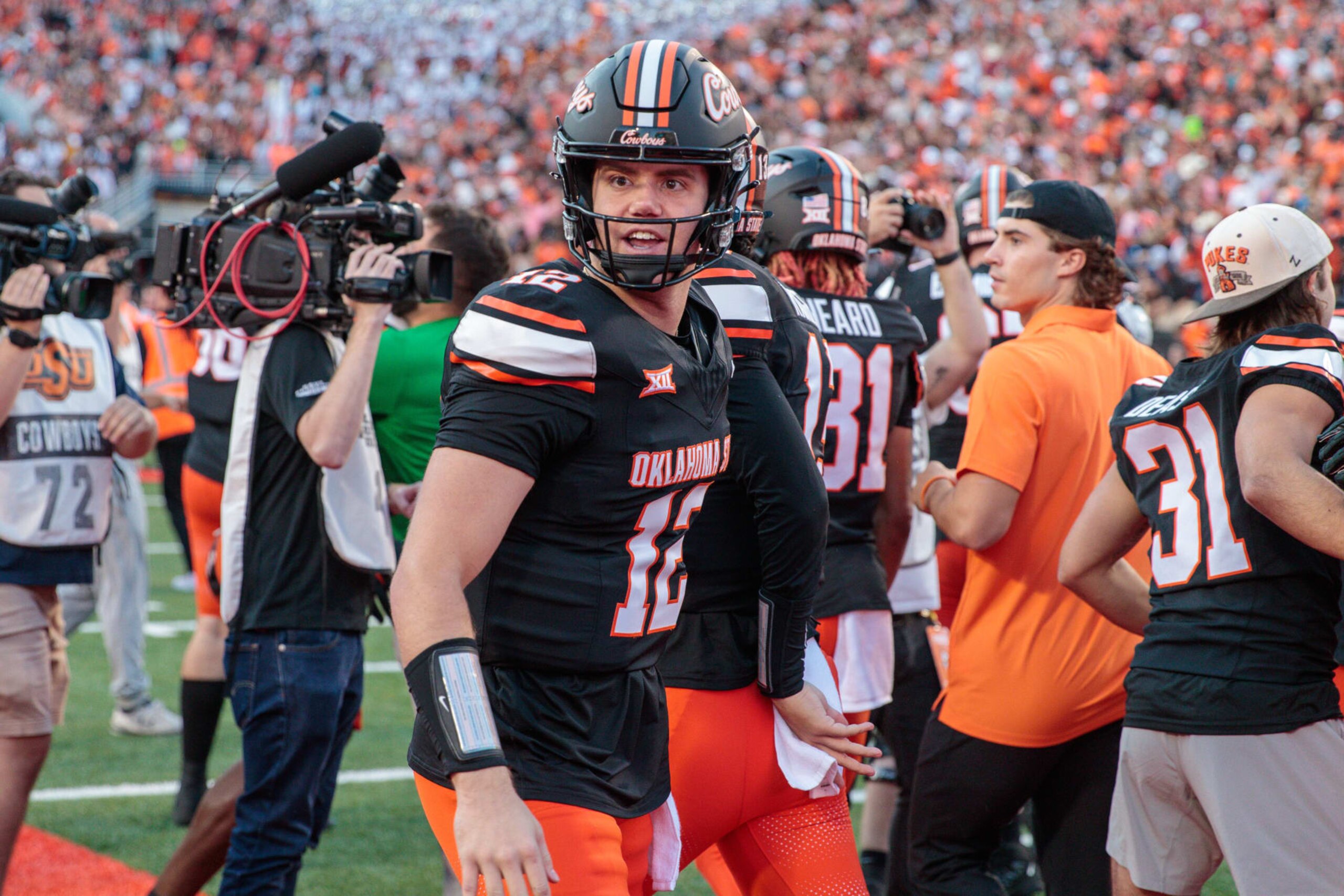 STILLWATER, OK - NOVEMBER 04: Oklahoma State Cowboys quarterback Gunnar Gundy (12) on the field after the game against the Oklahoma Sooners on November 4th, 2023 at Boone Pickens Stadium in Stillwater, Oklahoma. (Photo by William Purnell/Icon Sportswire via Getty Images) STILLWATER, OK - NOVEMBER 04: Oklahoma State Cowboys quarterback Gunnar Gundy (12) on the field after the game against the Oklahoma Sooners on November 4th, 2023 at Boone Pickens Stadium in Stillwater, Oklahoma. (Photo by William Purnell/Icon Sportswire via Getty Images)