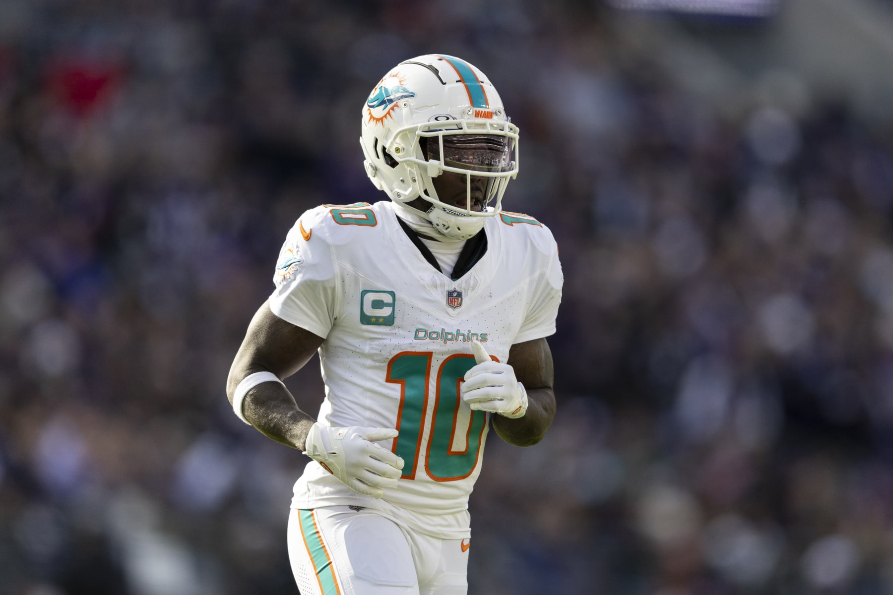 BALTIMORE, MARYLAND - DECEMBER 31: Tyreek Hill #10 of the Miami Dolphins runs during an NFL football game between the Baltimore Ravens and the Miami Dolphins at M&T Bank Stadium on December 31, 2023 in Baltimore, Maryland. (Photo by Michael Owens/Getty Images)