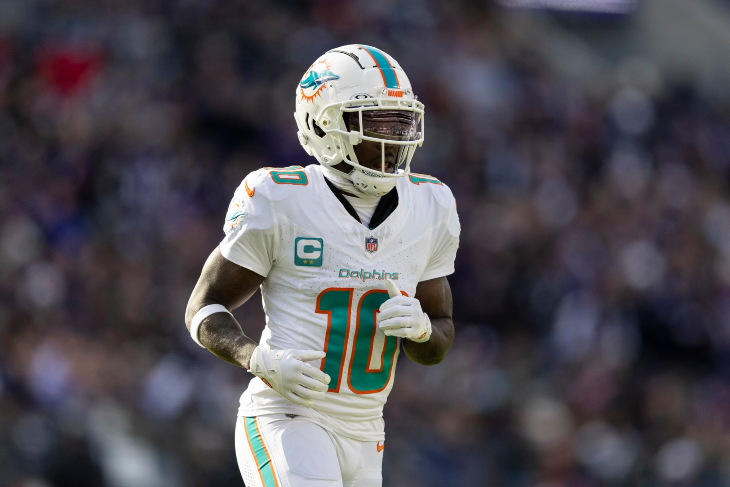 BALTIMORE, MARYLAND - DECEMBER 31: Tyreek Hill #10 of the Miami Dolphins runs during an NFL football game between the Baltimore Ravens and the Miami Dolphins at M&T Bank Stadium on December 31, 2023 in Baltimore, Maryland. (Photo by Michael Owens/Getty Images)