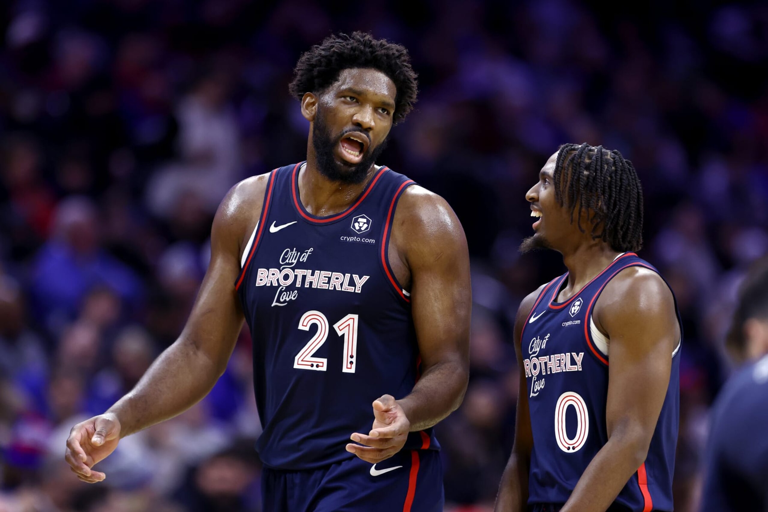 PHILADELPHIA, PENNSYLVANIA - DECEMBER 20: Joel Embiid #21 and Tyrese Maxey #0 of the Philadelphia 76ers speak during the second quarter against the Minnesota Timberwolves at the Wells Fargo Center on December 20, 2023 in Philadelphia, Pennsylvania. NOTE TO USER: User expressly acknowledges and agrees that, by downloading and or using this photograph, User is consenting to the terms and conditions of the Getty Images License Agreement. (Photo by Tim Nwachukwu/Getty Images)