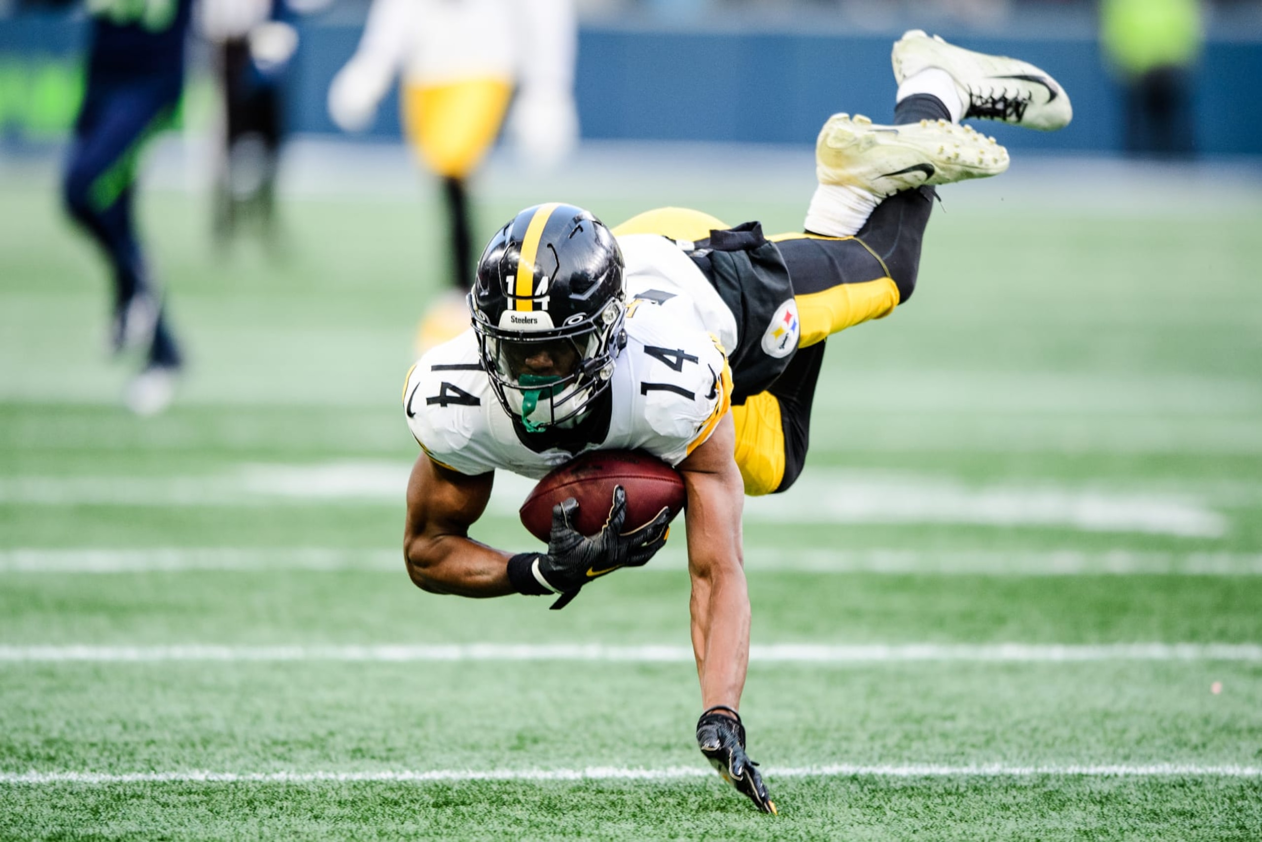 SEATTLE, WASHINGTON - DECEMBER 31: George Pickens #14 of the Pittsburgh Steelers catches the ball during the fourth quarter of the game against the Seattle Seahawks at Lumen Field on December 31, 2023 in Seattle, Washington. (Photo by Jane Gershovich/Getty Images)