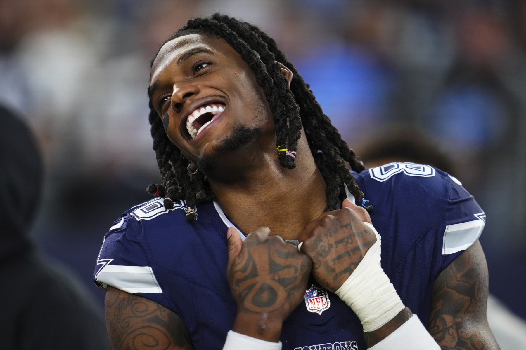 ARLINGTON, TX - DECEMBER 30: CeeDee Lamb #88 of the Dallas Cowboys looks on from the sideline prior to an NFL football game against the Detroit Lions at AT&T Stadium on December 30, 2023 in Arlington, Texas. (Photo by Cooper Neill/Getty Images)