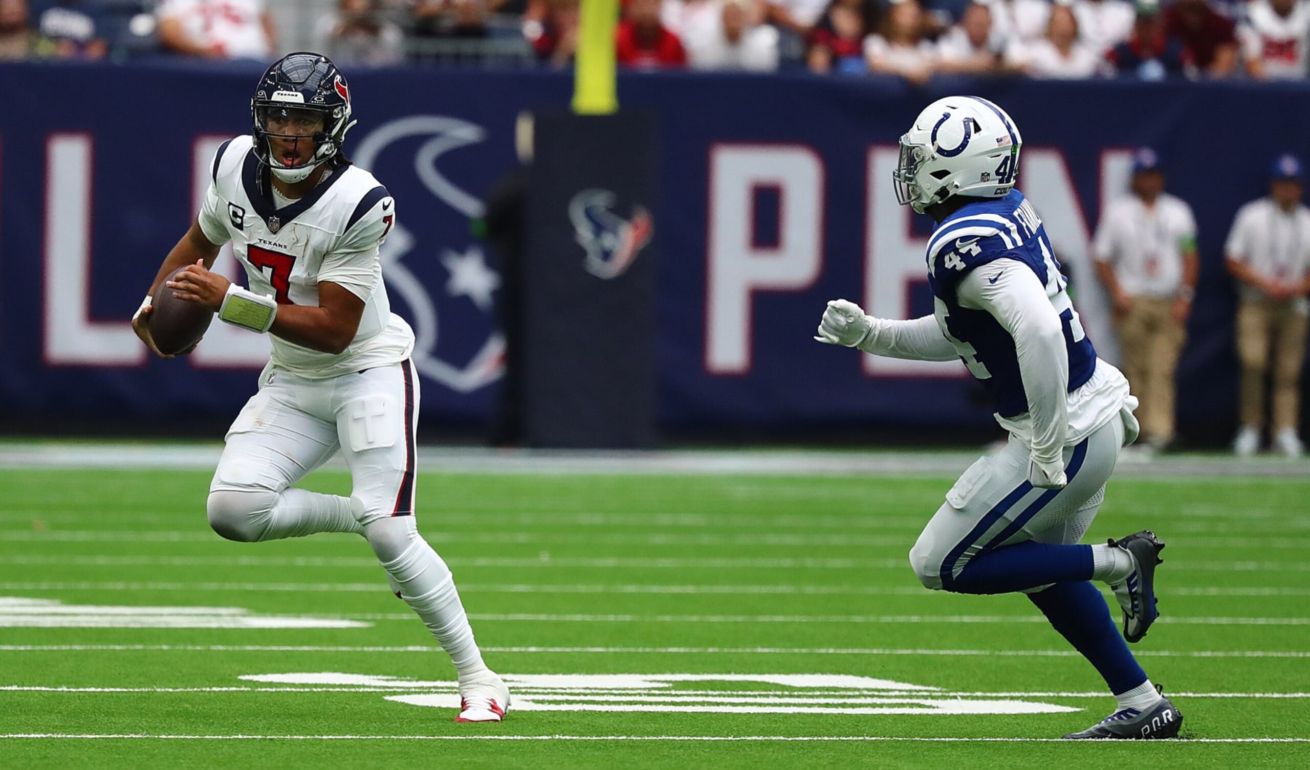 HOUSTON, TEXAS - SEPTEMBER 17:  C.J. Stroud #7 of the Houston Texans runs withe ball during the second half against the Indianapolis Colts at NRG Stadium on September 17, 2023 in Houston, Texas. (Photo by Bob Levey/Getty Images)