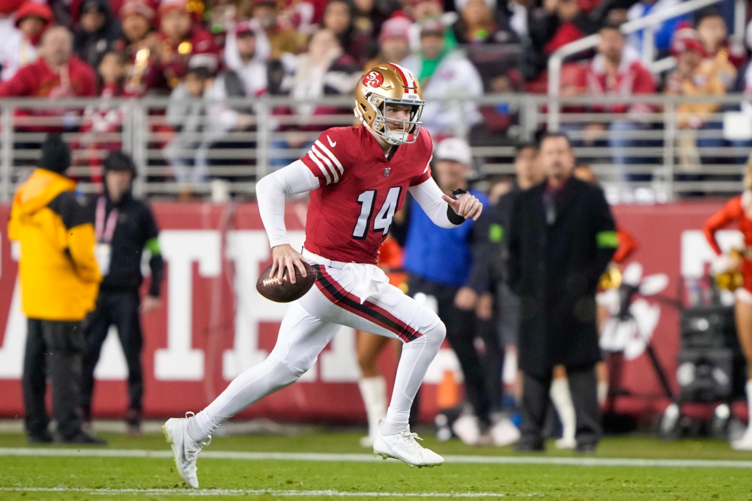 SANTA CLARA, CALIFORNIA - DECEMBER 25: Sam Darnold #14 of the San Francisco 49ers attempts a pass during the fourth quarter against the Baltimore Ravens at Levi's Stadium on December 25, 2023 in Santa Clara, California. (Photo by Thearon W. Henderson/Getty Images)
