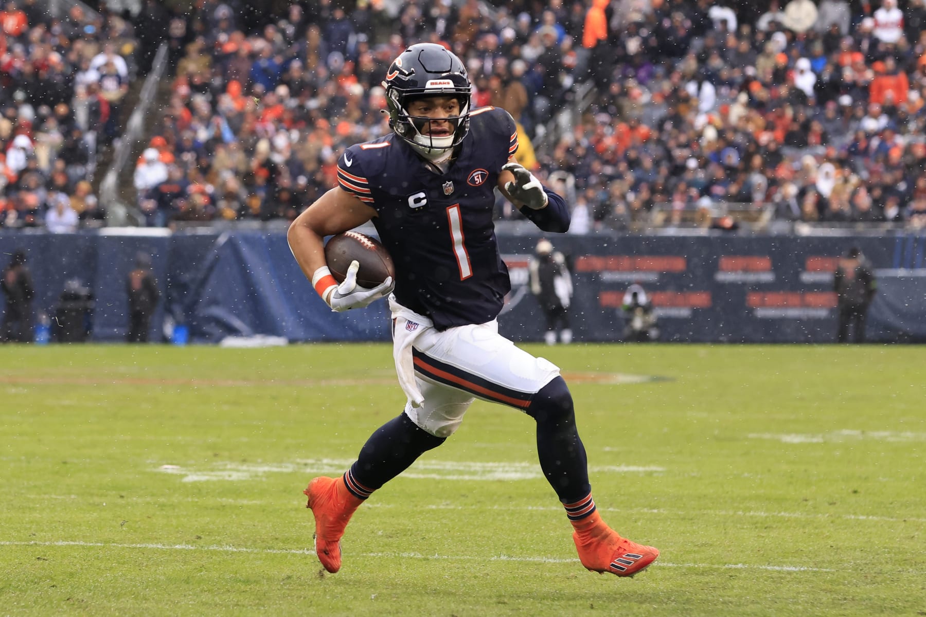 CHICAGO, ILLINOIS - DECEMBER 31: Justin Fields #1 of the Chicago Bears runs the ball in the game against the Atlanta Falcons at Soldier Field on December 31, 2023 in Chicago, Illinois. (Photo by Justin Casterline/Getty Images)
