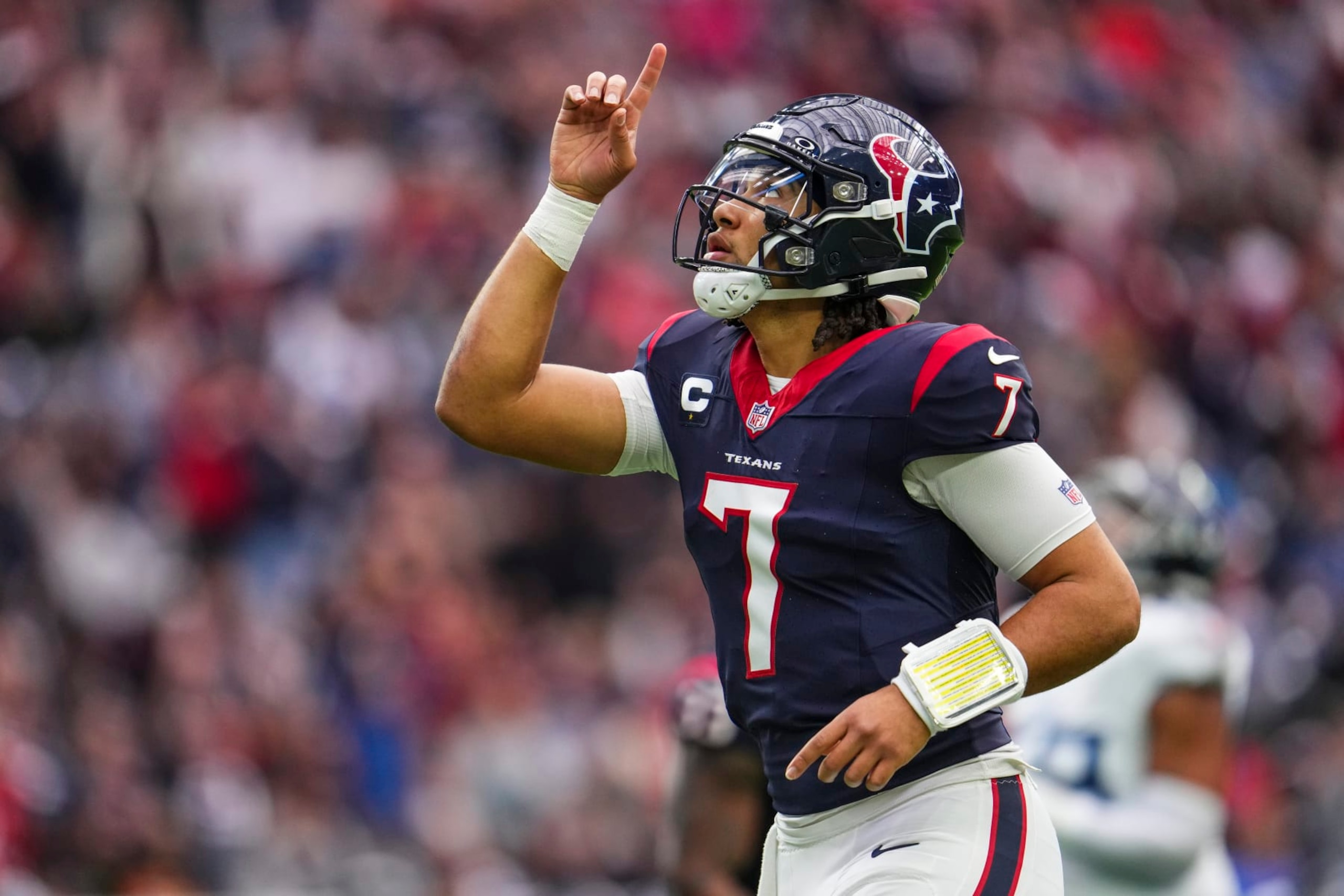 HOUSTON, TX - DECEMBER 31: C.J. Stroud #7 of the Houston Texans celebrates during an NFL football game against the Tennessee Titans at NRG Stadium on December 31, 2023 in Houston, Texas. (Photo by Cooper Neill/Getty Images)
