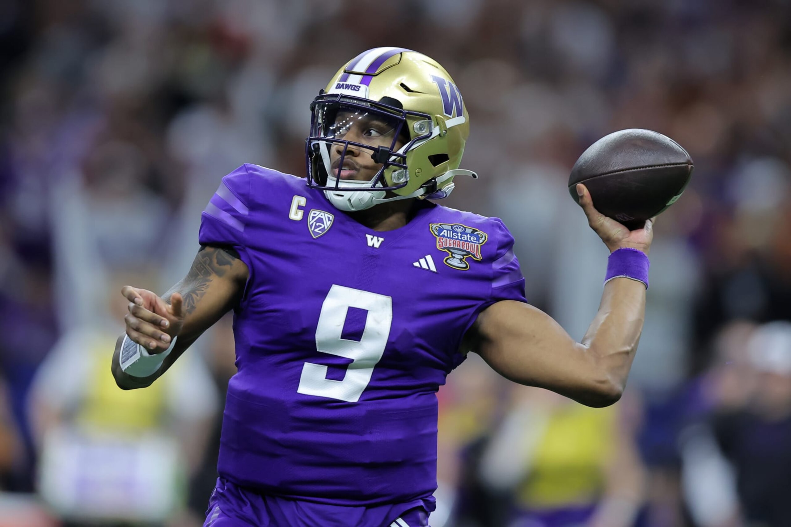NEW ORLEANS, LOUISIANA - JANUARY 01: Michael Penix Jr. #9 of the Washington Huskies throws the ball against the Texas Longhorns during the CFP Semifinal Allstate Sugar Bowl at Caesars Superdome on January 01, 2024 in New Orleans, Louisiana. (Photo by Jonathan Bachman/Getty Images)