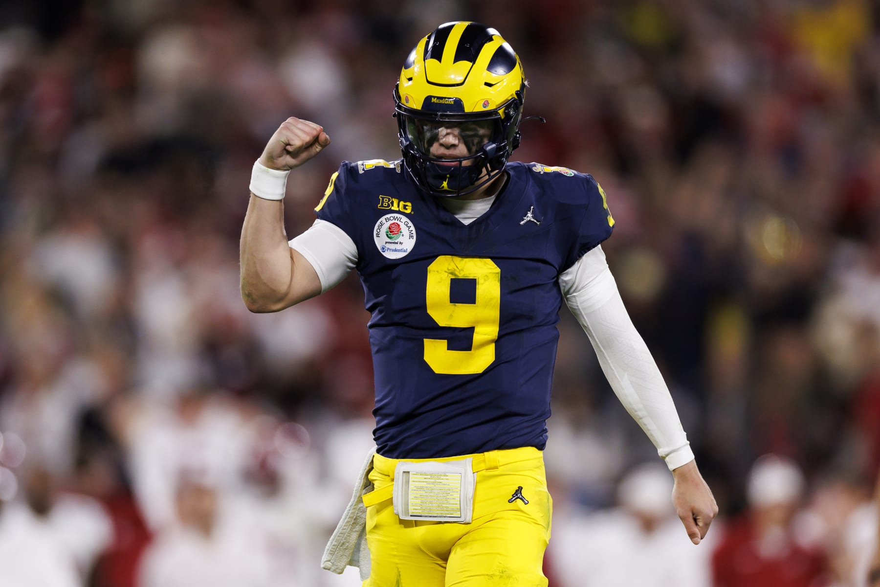 PASADENA, CALIFORNIA - JANUARY 01: Quarterback J.J. McCarthy #9 of the Michigan Wolverines celebrates after scoring a touchdown in overtime during the CFP Semifinal Rose Bowl Game against the Alabama Crimson Tide at Rose Bowl Stadium on January 1, 2024 in Pasadena, California. (Photo by Ryan Kang/Getty Images)