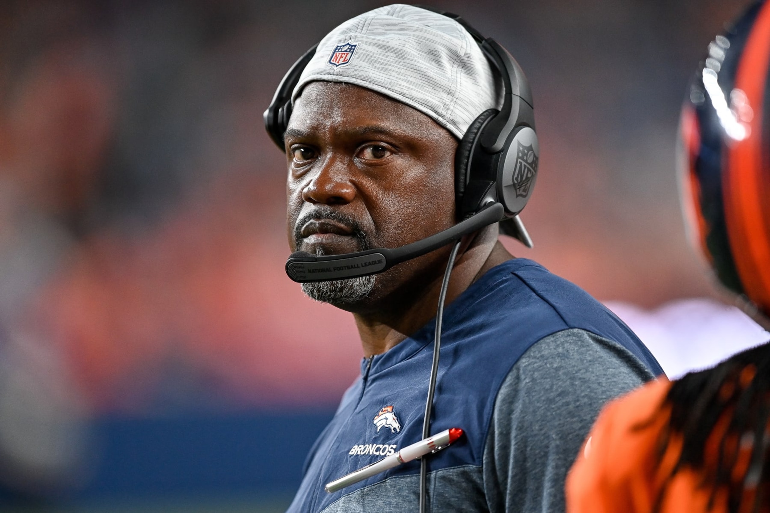 DENVER, COLORADO - AUGUST 27:  Running backs coach Tyrone Wheatley loooks on from the bench area during a preseason NFL game against the Minnesota Vikings at Empower Field at Mile High on August 27, 2022 in Denver, Colorado. (Photo by Dustin Bradford/Getty Images)