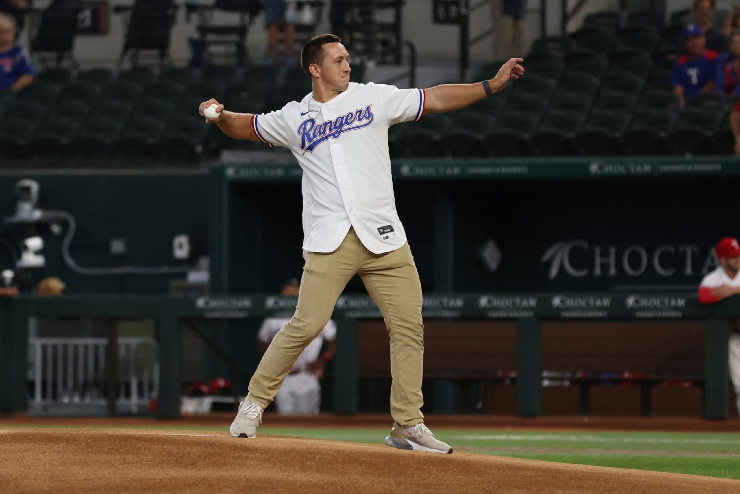 ARLINGTON, TEXAS - JULY 18: Texas Rangers first round draft pick Wyatt Langford throws out the first pitch before the game against the Tampa Bay Rays at Globe Life Field on July 18, 2023 in Arlington, Texas. (Photo by Tim Heitman/Getty Images)