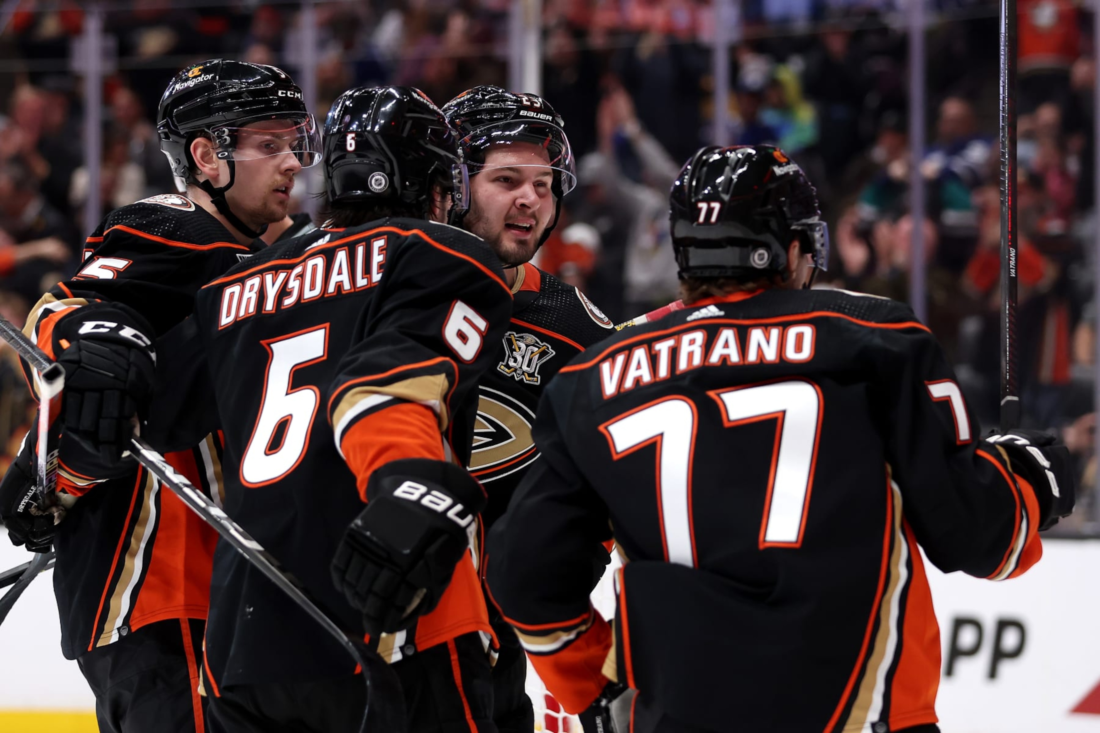 ANAHEIM, CALIFORNIA - JANUARY 03: Urho Vaakanainen #5, Jamie Drysdale #6 and Mason McTavish #23 congratulate Frank Vatrano #77 of the Anaheim Ducks after his goal during the second period of a game against the Toronto Maple Leafs at Honda Center on January 03, 2024 in Anaheim, California. (Photo by Sean M. Haffey/Getty Images) ANAHEIM, CALIFORNIA - JANUARY 03: Urho Vaakanainen #5, Jamie Drysdale #6 and Mason McTavish #23 congratulate Frank Vatrano #77 of the Anaheim Ducks after his goal during the second period of a game against the Toronto Maple Leafs at Honda Center on January 03, 2024 in Anaheim, California. (Photo by Sean M. Haffey/Getty Images)