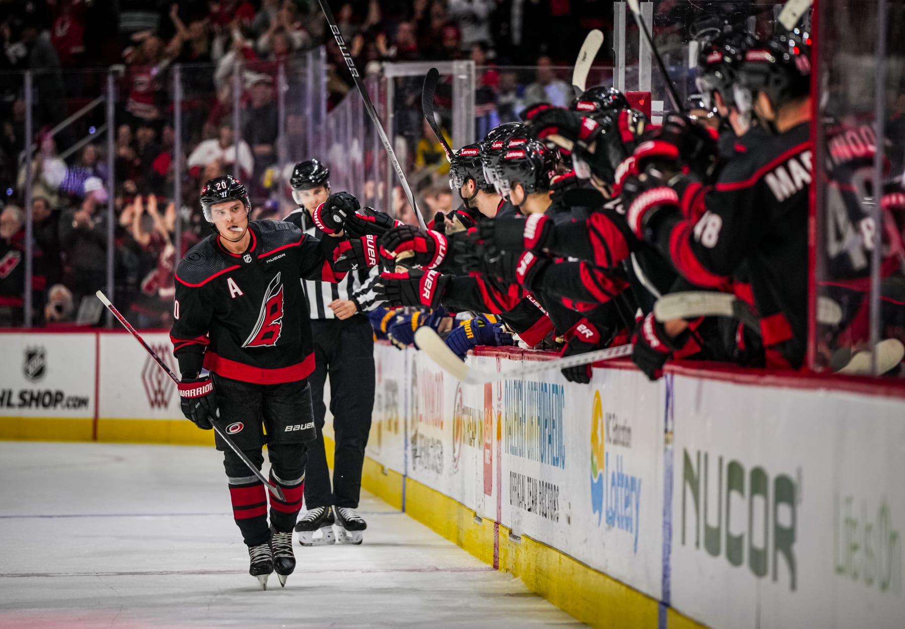 RALEIGH, NORTH CAROLINA - JANUARY 06: Sebastian Aho #20 of the Carolina Hurricanes celebrates with teammates after scoring a goal in a shoot out against the St. Louis Blues at PNC Arena on January 06, 2024 in Raleigh, North Carolina. (Photo by Josh Lavallee/NHLI via Getty Images)