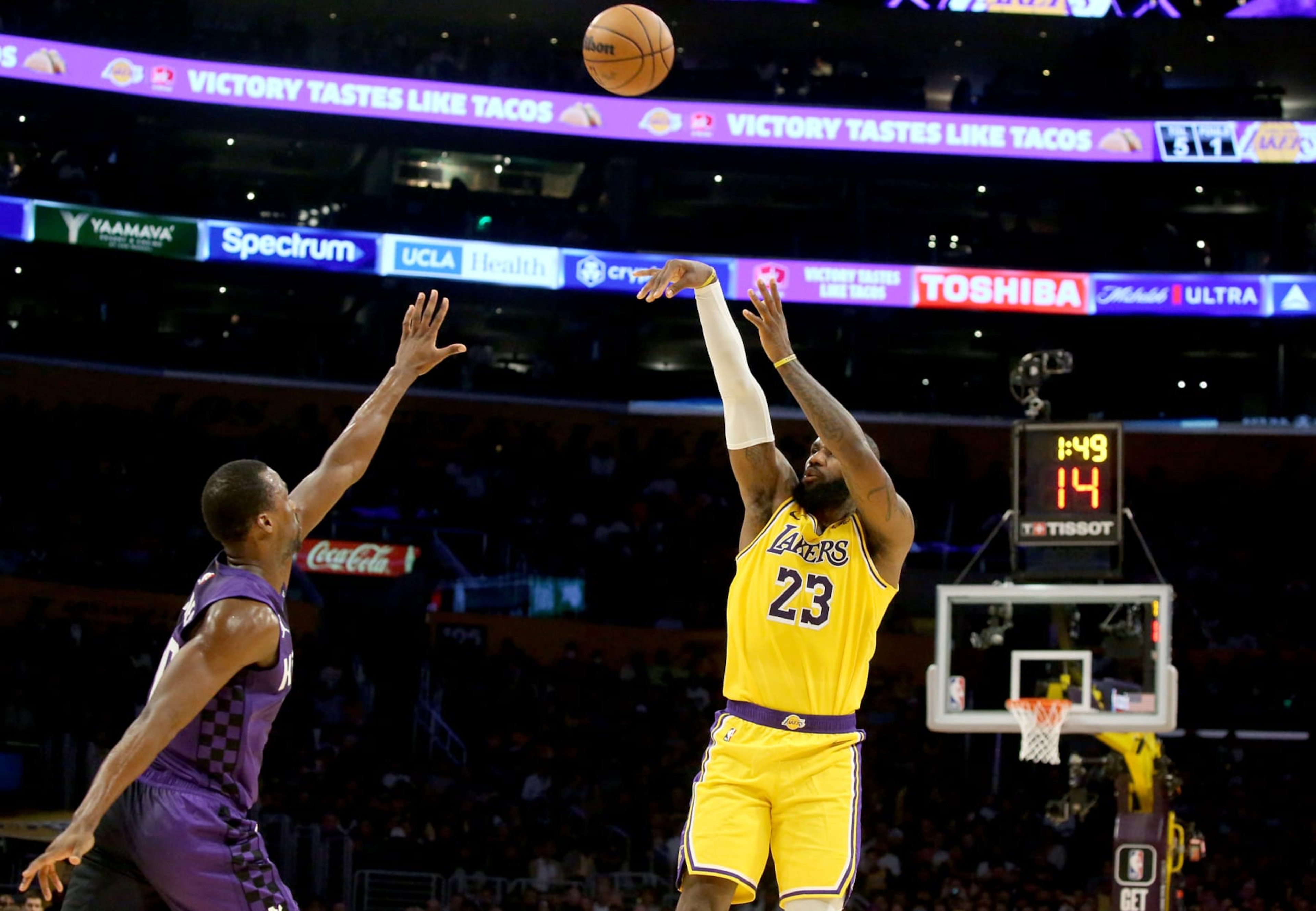 Los Angeles, CA - Lakers forward LeBron James shoots and scores a three-pointer against Kings defender Harrison Barnes in the first half at crypto.com Arena in Los Angeles on Wednesday night, Nov. 15, 2023. (Luis Sinco / Los Angeles Times via Getty Images) Los Angeles, CA - Lakers forward LeBron James shoots and scores a three-pointer against Kings defender Harrison Barnes in the first half at crypto.com Arena in Los Angeles on Wednesday night, Nov. 15, 2023. (Luis Sinco / Los Angeles Times via Getty Images)