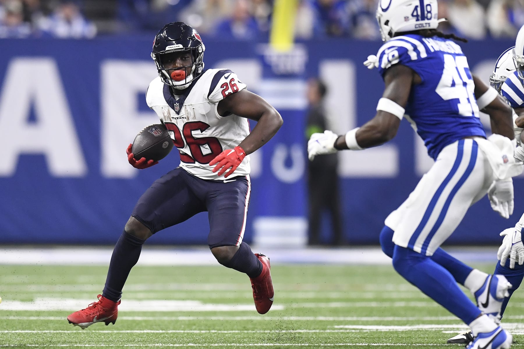INDIANAPOLIS, IN - JANUARY 06: Houston Texans Running Back Devin Singletary (26) carries during the NFL game between the Houston Texans and the Indianapolis Colts on January 6, 2024, at Lucas Oil Stadium in Indianapolis, Indiana. (Photo by Michael Allio/Icon Sportswire via Getty Images)
