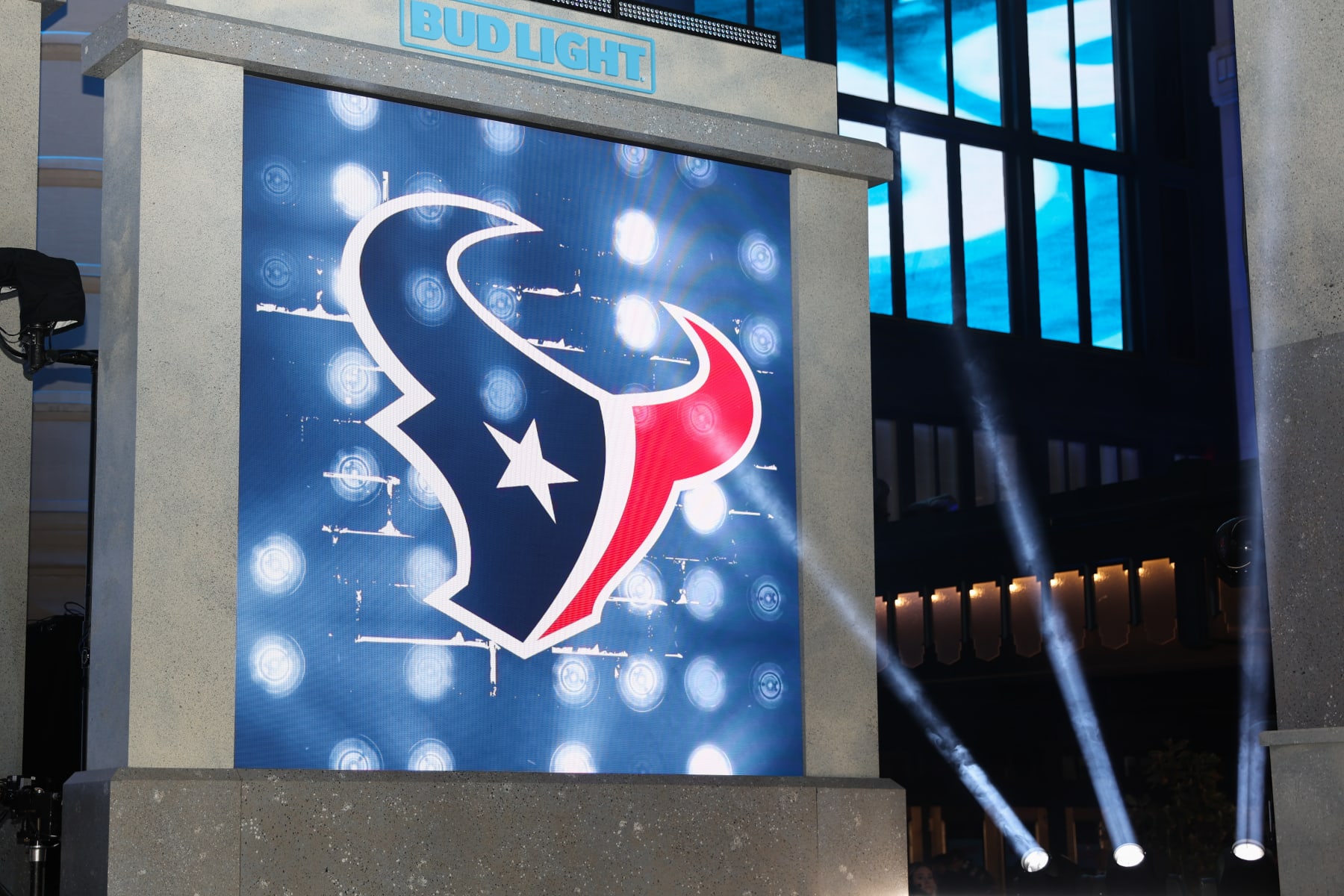 KANSAS CITY, MO - APRIL 27: Spotlights shine on the Houston Texans logo in the first round of the NFL Draft on April 27, 2023 at Union Station in Kansas City, MO. (Photo by Scott Winters/Icon Sportswire via Getty Images)