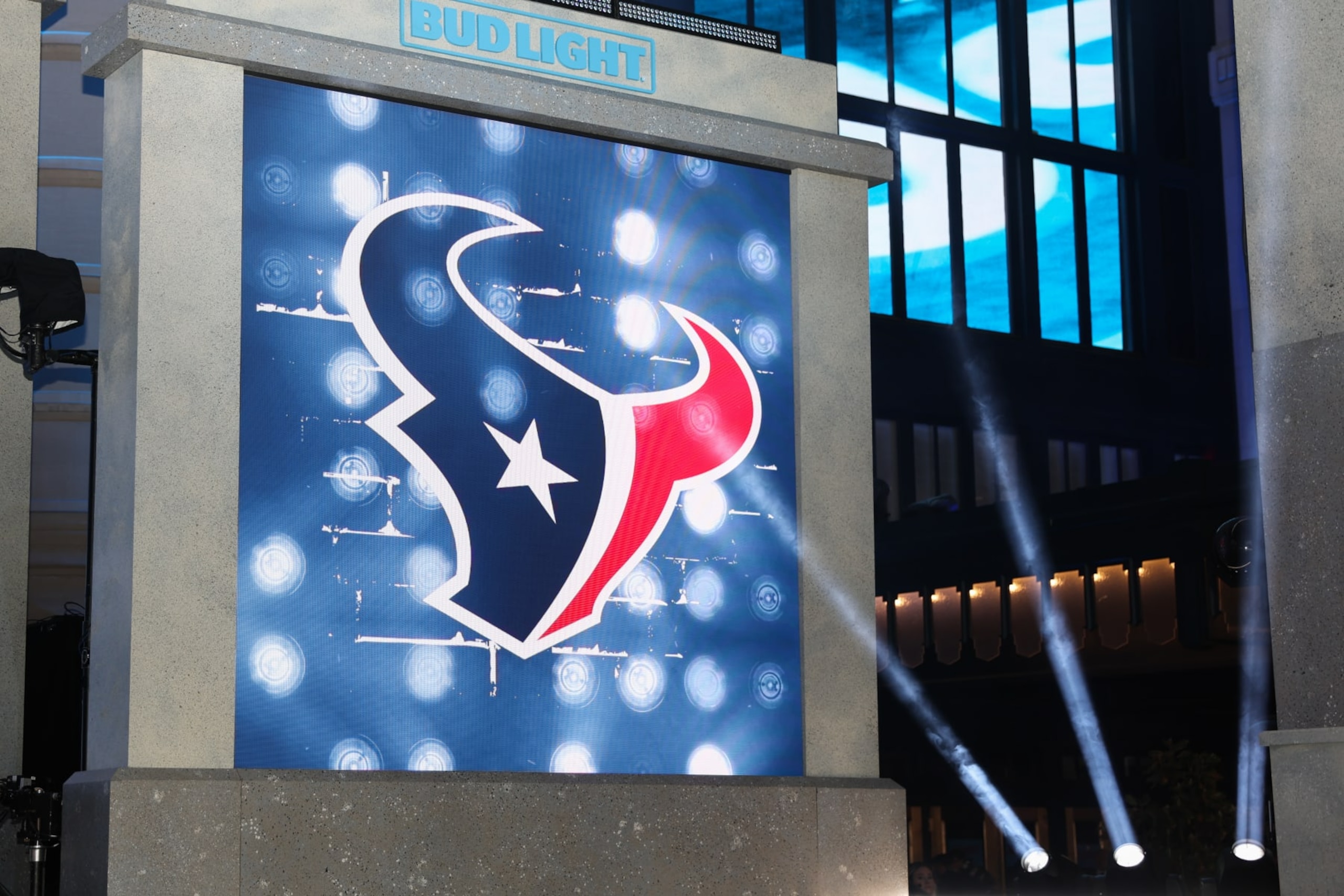 KANSAS CITY, MO - APRIL 27: Spotlights shine on the Houston Texans logo in the first round of the NFL Draft on April 27, 2023 at Union Station in Kansas City, MO. (Photo by Scott Winters/Icon Sportswire via Getty Images)
