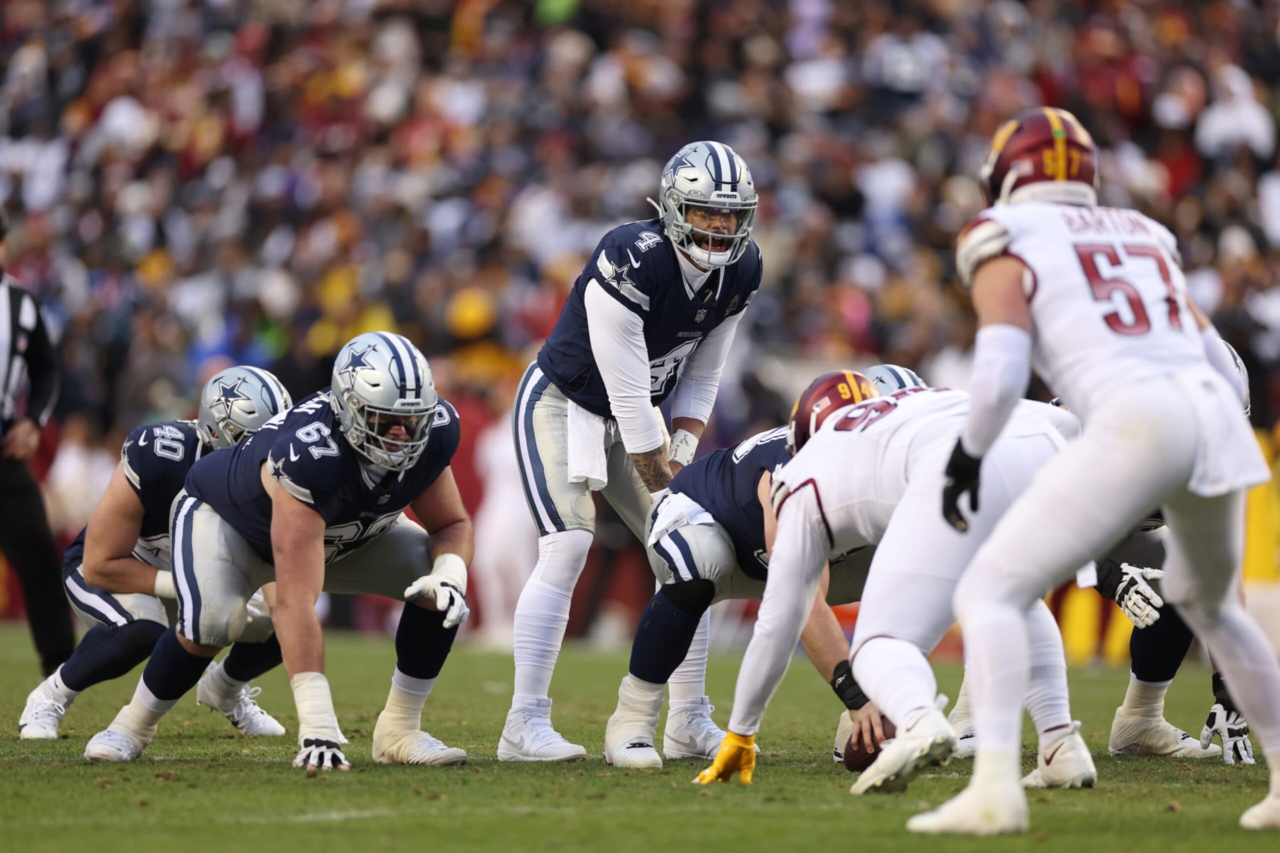 LANDOVER, MARYLAND - JANUARY 07: Dak Prescott #4 of the Dallas Cowboys calls a play during the first half against the Washington Commanders at FedExField on January 07, 2024 in Landover, Maryland. (Photo by Patrick Smith/Getty Images)