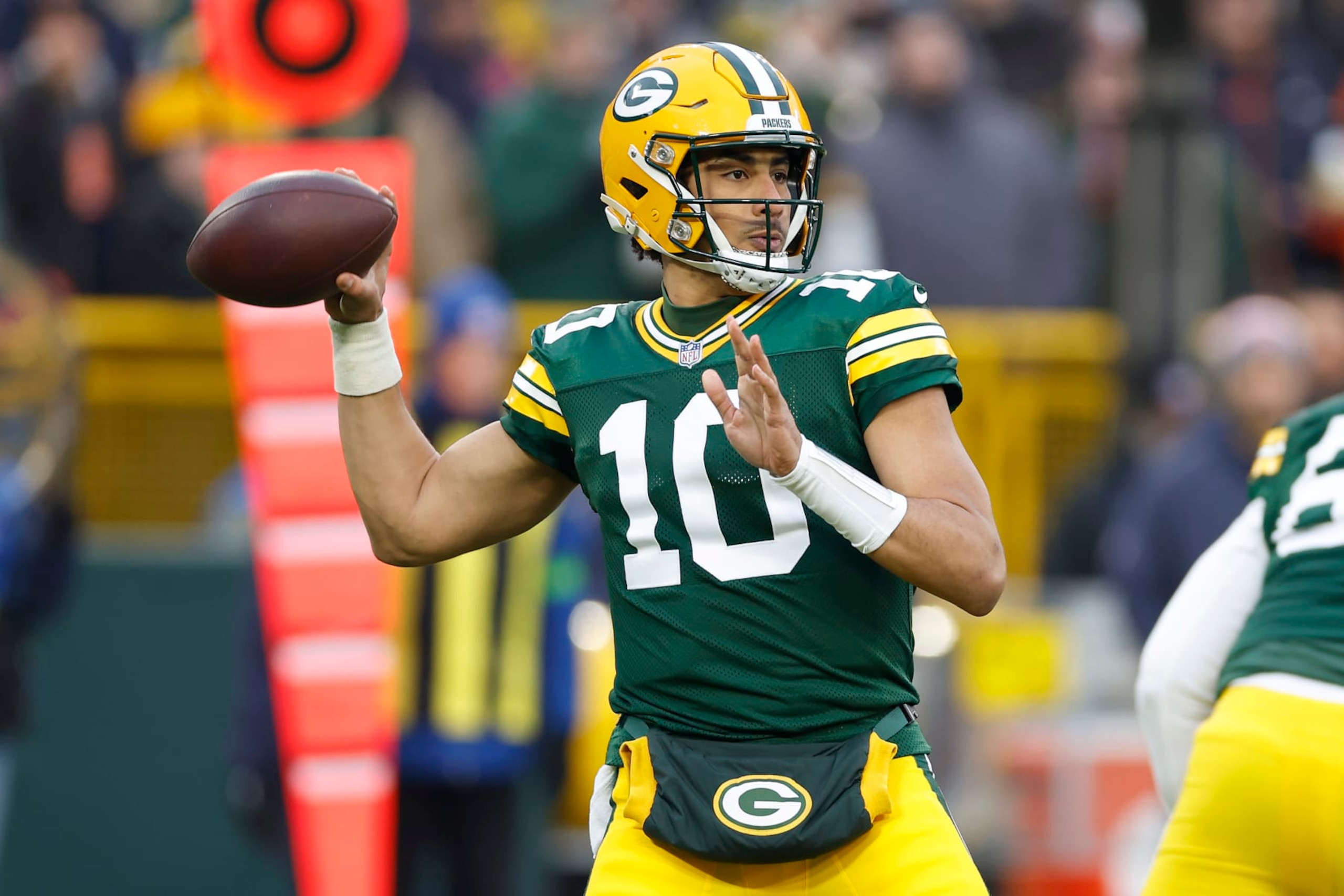 GREEN BAY, WISCONSIN - JANUARY 07: Jordan Love #10 of the Green Bay Packers throws a pass during the first quarter in the game against the Chicago Bears at Lambeau Field on January 07, 2024 in Green Bay, Wisconsin. (Photo by John Fisher/Getty Images)
