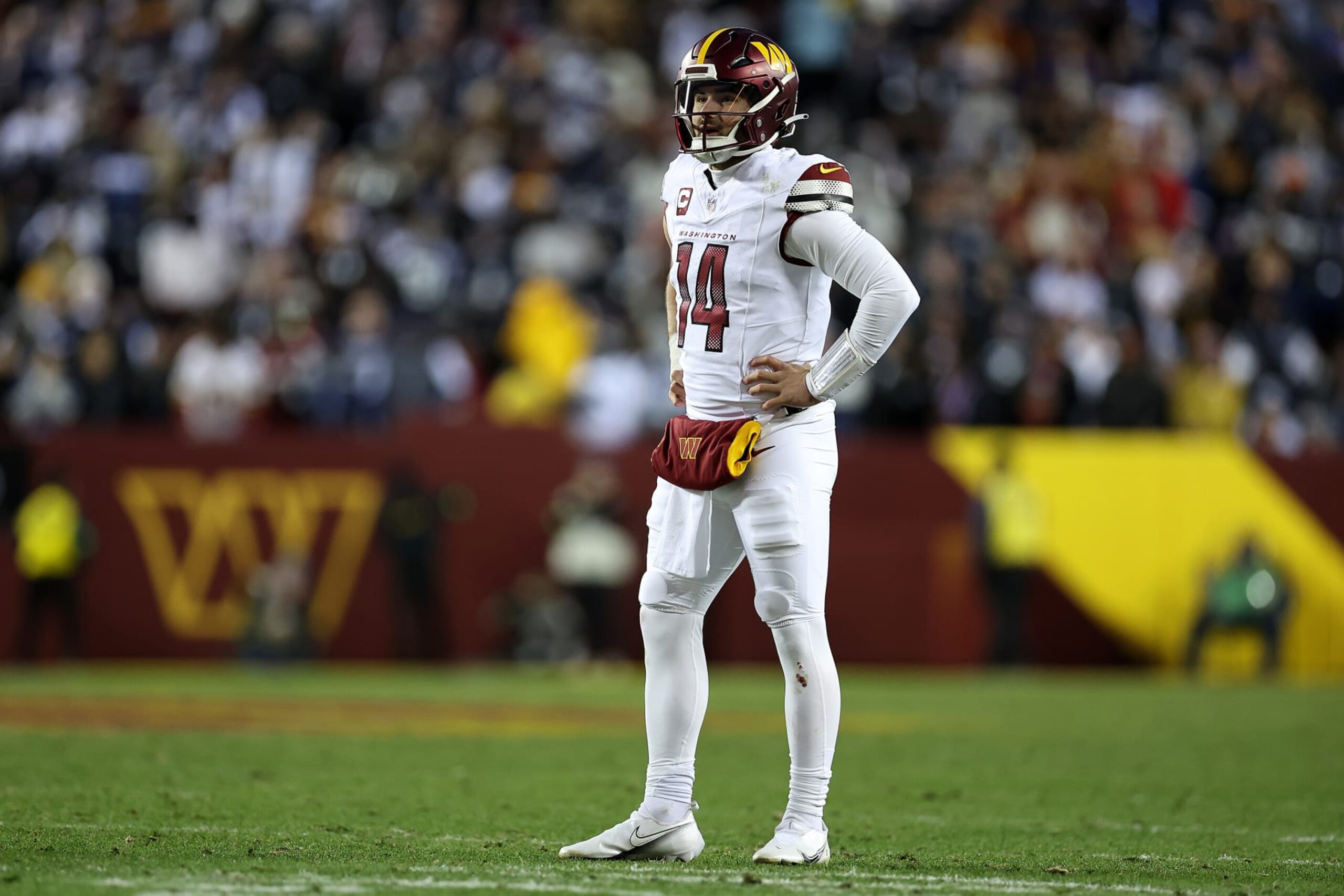 LANDOVER, MARYLAND - JANUARY 07: Sam Howell #14 of the Washington Commanders looks on during the second quarter against the Dallas Cowboys at FedExField on January 07, 2024 in Landover, Maryland. (Photo by Scott Taetsch/Getty Images) LANDOVER, MARYLAND - JANUARY 07: Sam Howell #14 of the Washington Commanders looks on during the second quarter against the Dallas Cowboys at FedExField on January 07, 2024 in Landover, Maryland. (Photo by Scott Taetsch/Getty Images)