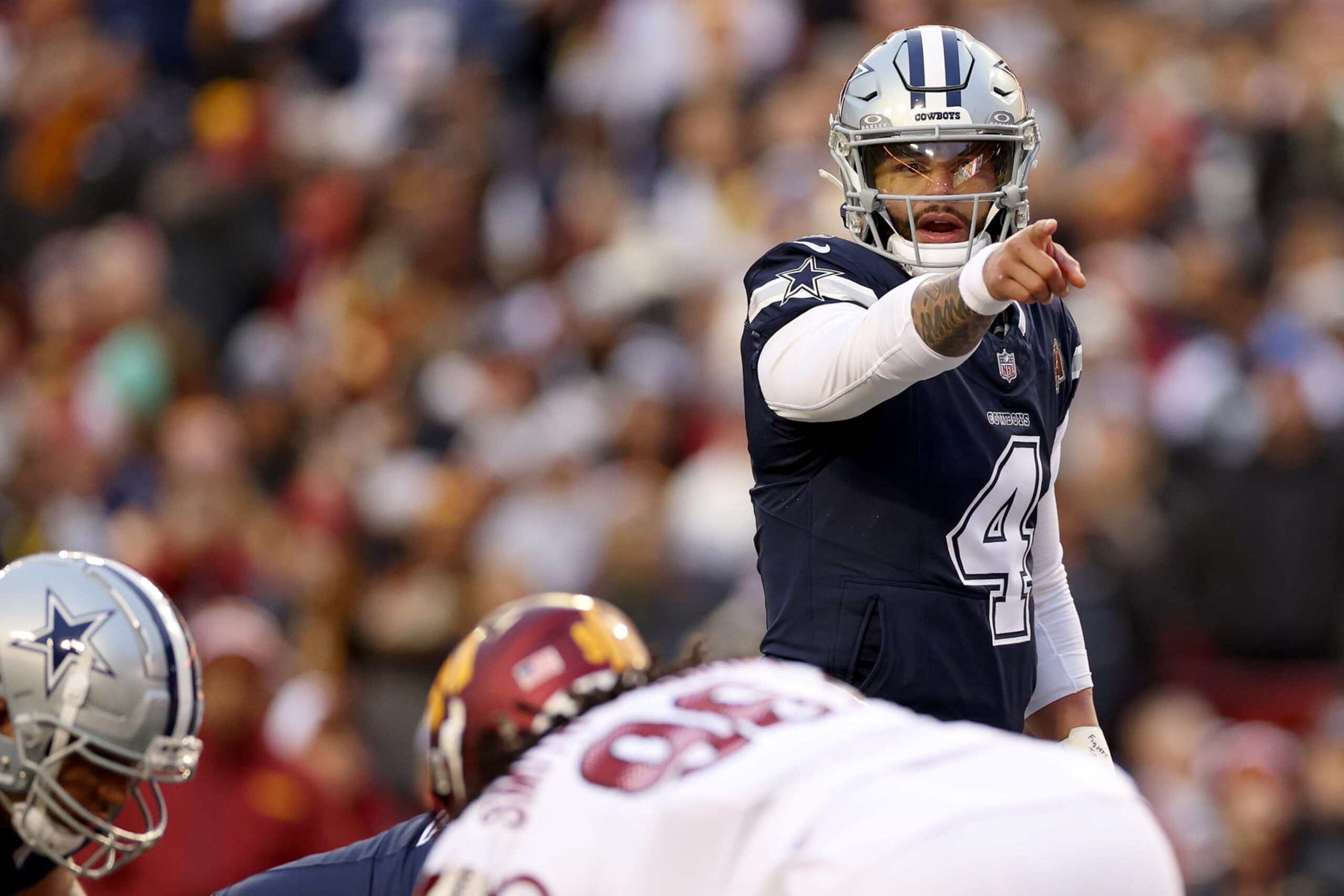 LANDOVER, MARYLAND - JANUARY 07: Dak Prescott #4 of the Dallas Cowboys calls a play during the first half against the Washington Commanders at FedExField on January 07, 2024 in Landover, Maryland. (Photo by Patrick Smith/Getty Images) LANDOVER, MARYLAND - JANUARY 07: Dak Prescott #4 of the Dallas Cowboys calls a play during the first half against the Washington Commanders at FedExField on January 07, 2024 in Landover, Maryland. (Photo by Patrick Smith/Getty Images)