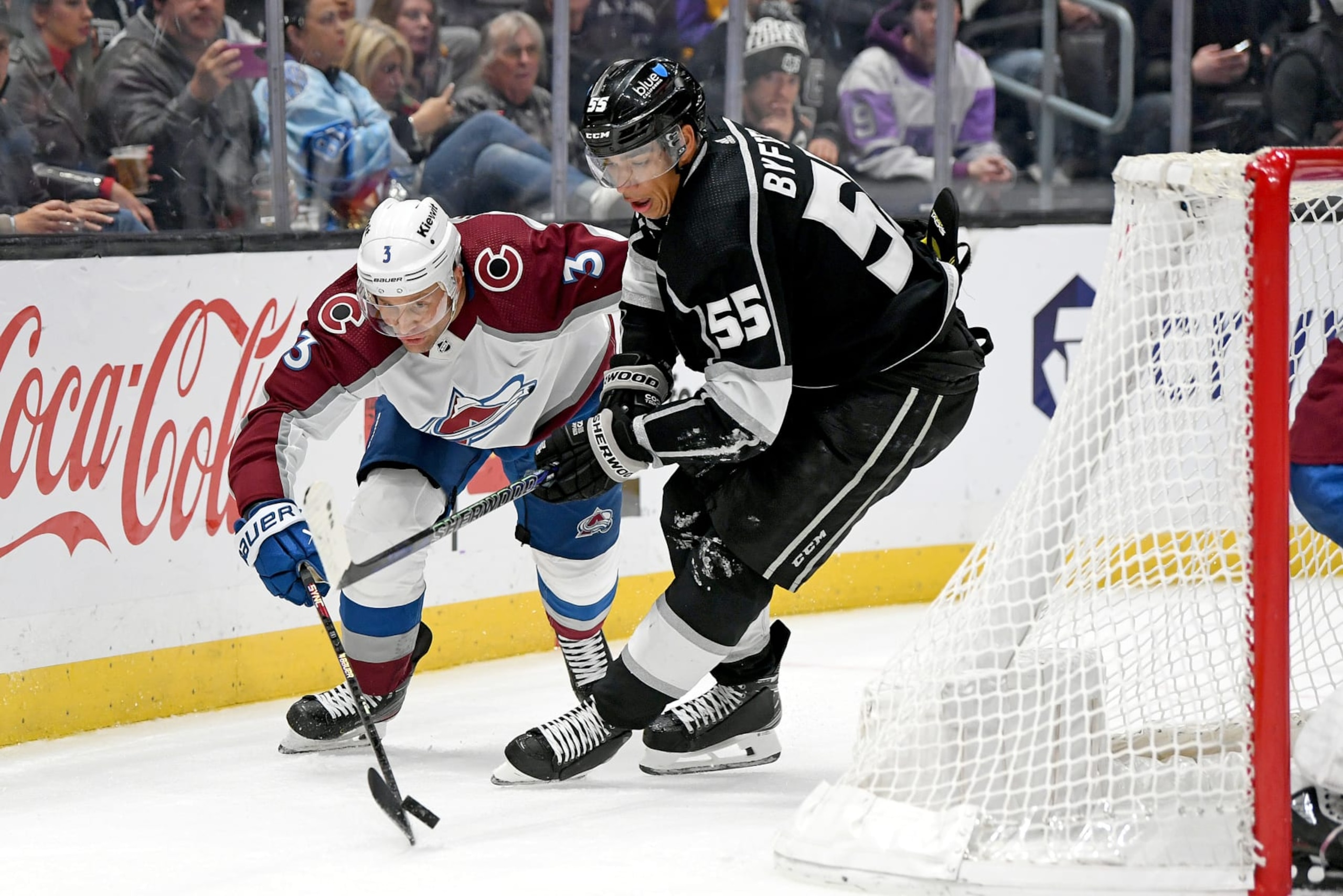 LOS ANGELES, CA - DECEMBER 03:  Los Angeles Kings Left Wing Quinton Byfield (55) and Colorado Avalanche Defenceman Jack Johnson (3) battle for the puck behind the Avalanche net during a game between the Colorado Avalanche and the Los Angeles Kings at the Crypto.com Arena in Los Angeles, CA.  (Photo by Rob Curtis/Icon Sportswire via Getty Images)