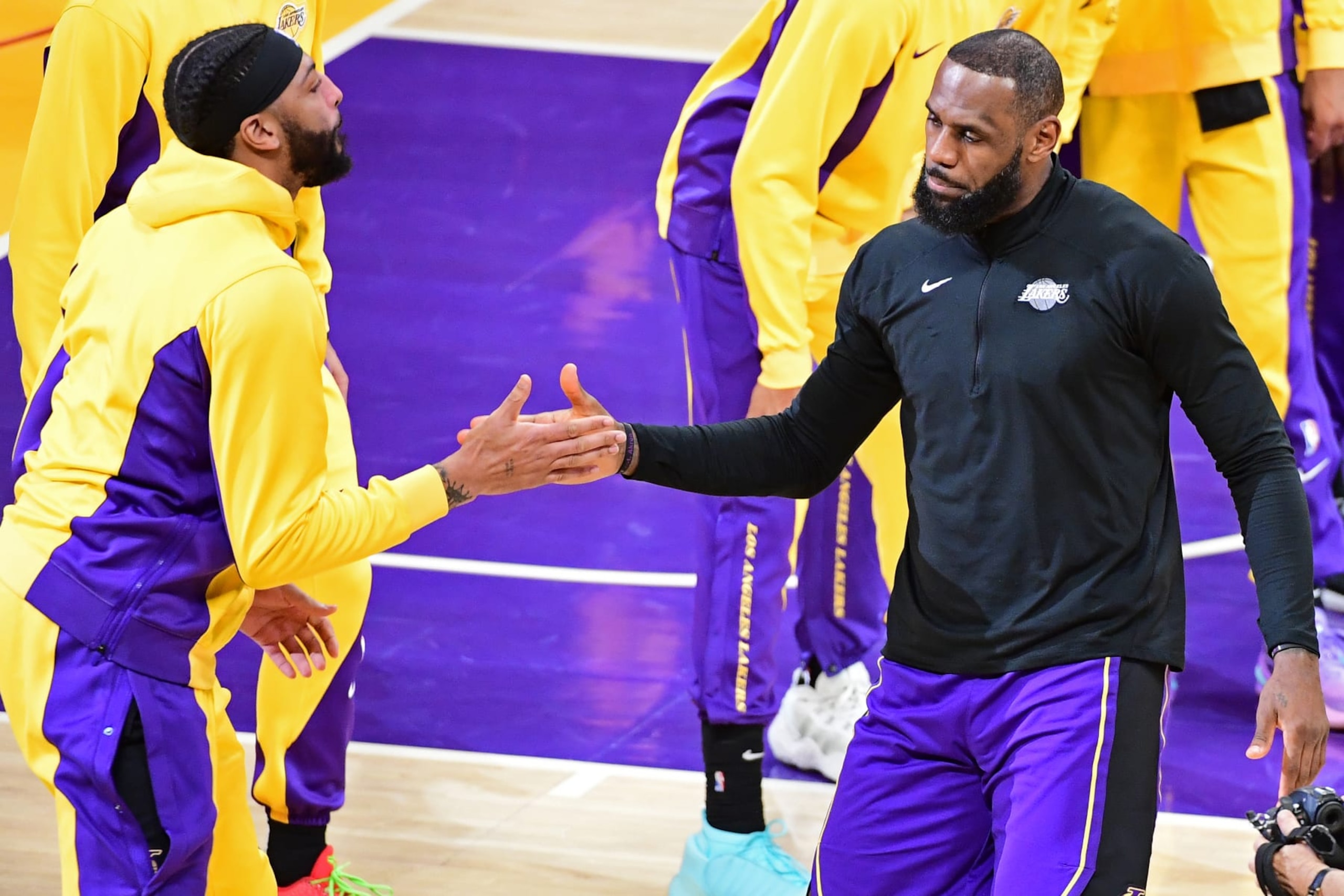 LOS ANGELES, CA - JANUARY 5: LeBron James #23 and Anthony Davis #3 of the Los Angeles Lakers high five before the game against the Memphis Grizzlies on January 5, 2024 at Crypto.Com Arena in Los Angeles, California. NOTE TO USER: User expressly acknowledges and agrees that, by downloading and/or using this Photograph, user is consenting to the terms and conditions of the Getty Images License Agreement. Mandatory Copyright Notice: Copyright 2024 NBAE (Photo by Adam Pantozzi/NBAE via Getty Images)