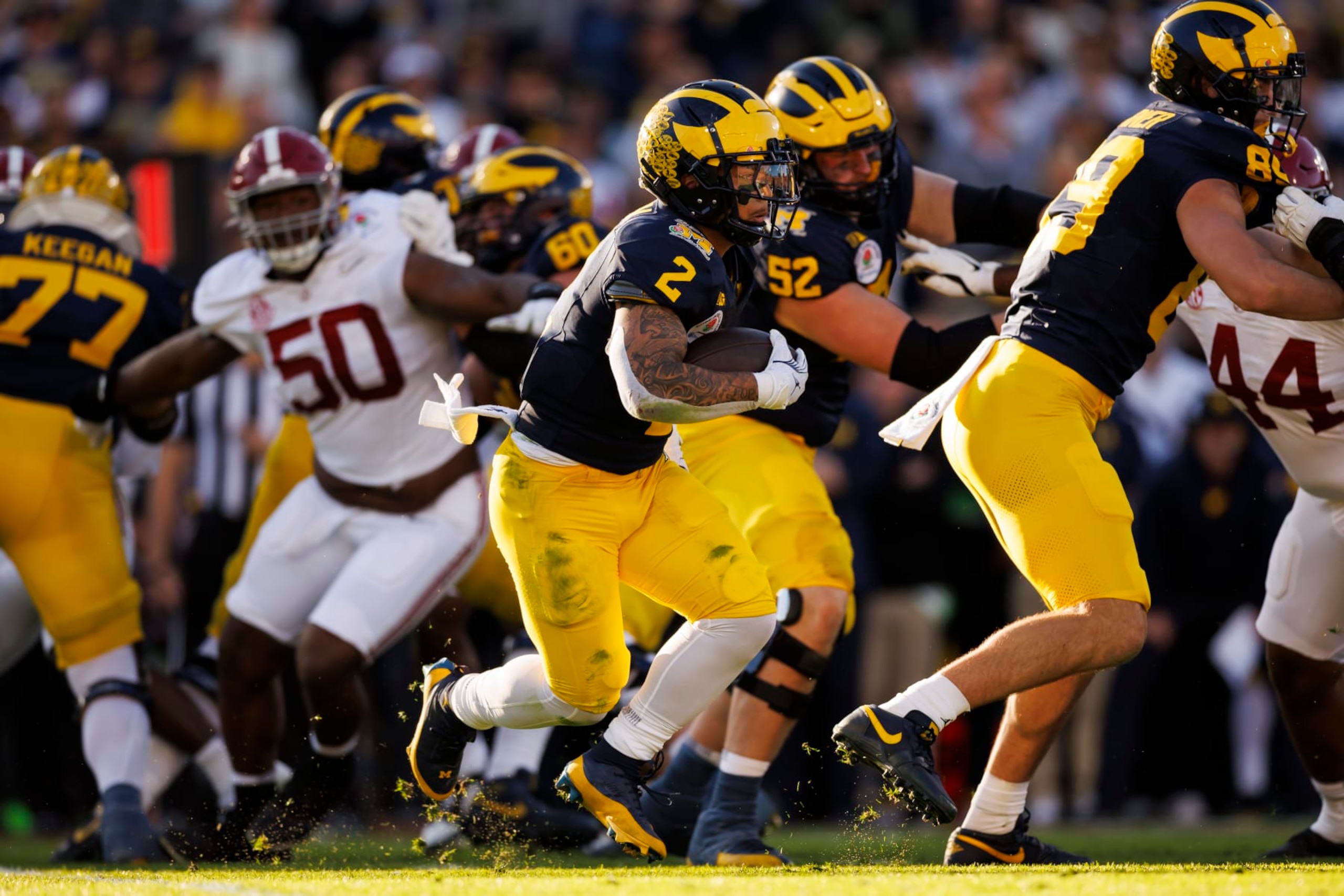 PASADENA, CALIFORNIA - JANUARY 01: Running back Blake Corum #2 of the Michigan Wolverines carries the ball on a run play during the CFP Semifinal Rose Bowl Game against the Alabama Crimson Tide at Rose Bowl Stadium on January 1, 2024 in Pasadena, California. (Photo by Ryan Kang/Getty Images)