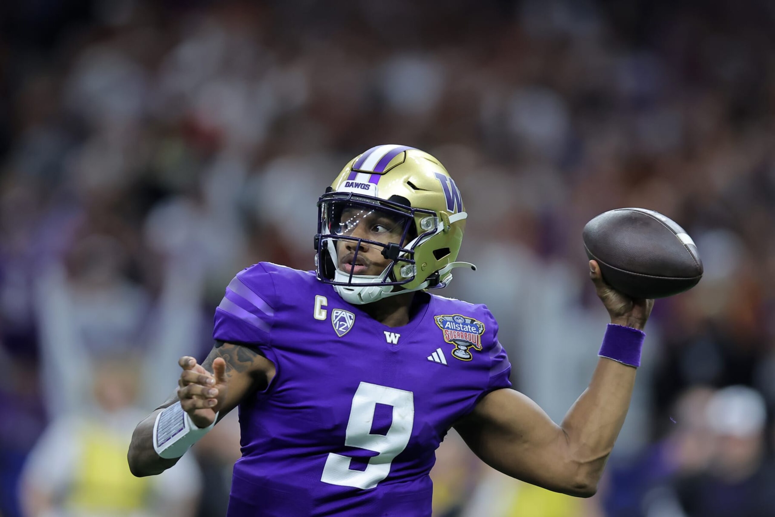 NEW ORLEANS, LOUISIANA - JANUARY 01: Michael Penix Jr. #9 of the Washington Huskies throws the ball against the Texas Longhorns during the CFP Semifinal Allstate Sugar Bowl at Caesars Superdome on January 01, 2024 in New Orleans, Louisiana. (Photo by Jonathan Bachman/Getty Images)