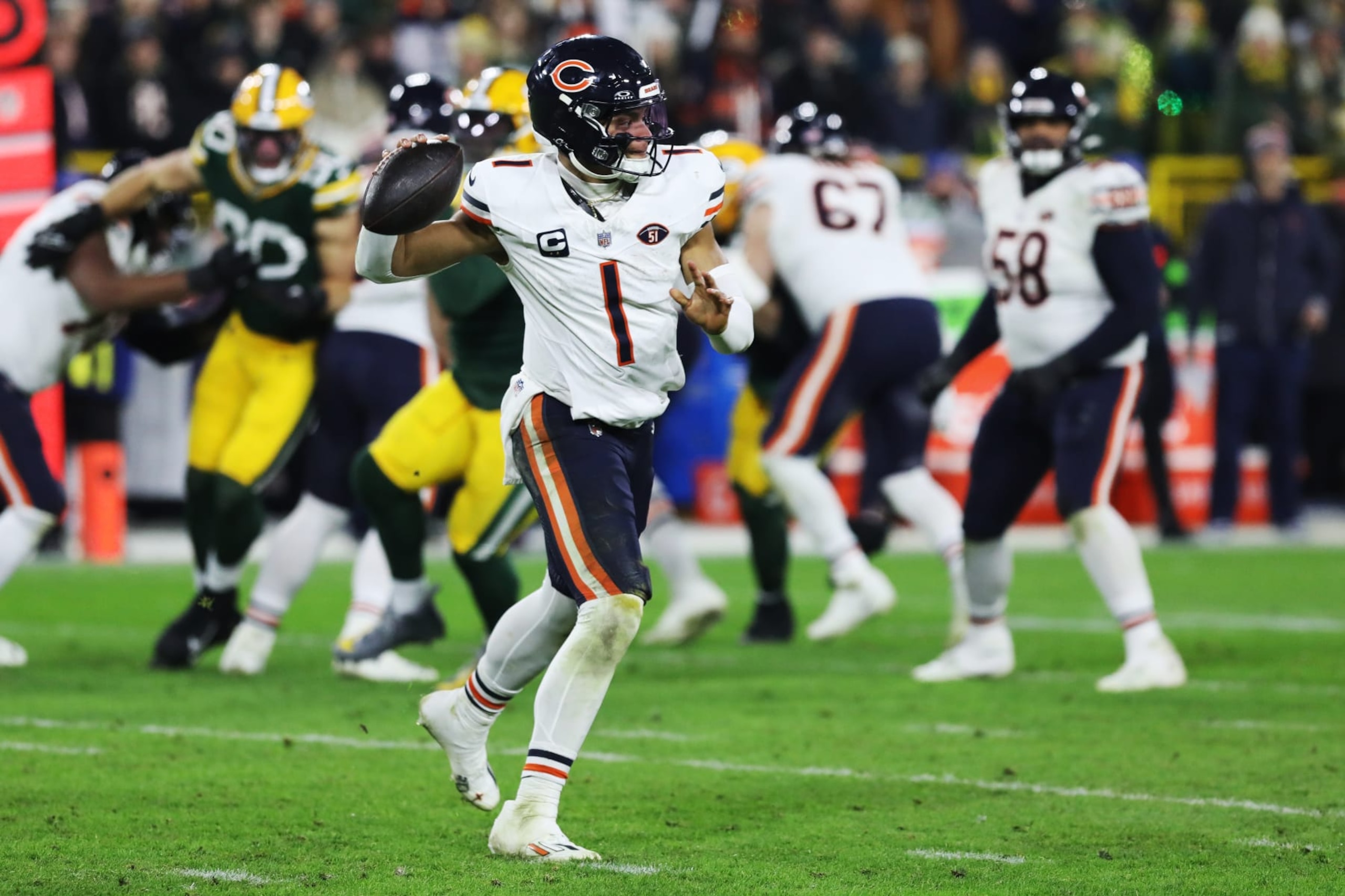 GREEN BAY, WI - JANUARY 07: Chicago Bears quarterback Justin Fields (1) passes during a game between the Green Bay Packers and the Chicago Bears at Lambeau Field on January 7, 2024 in Green Bay, WI. (Photo by Larry Radloff/Icon Sportswire via Getty Images)