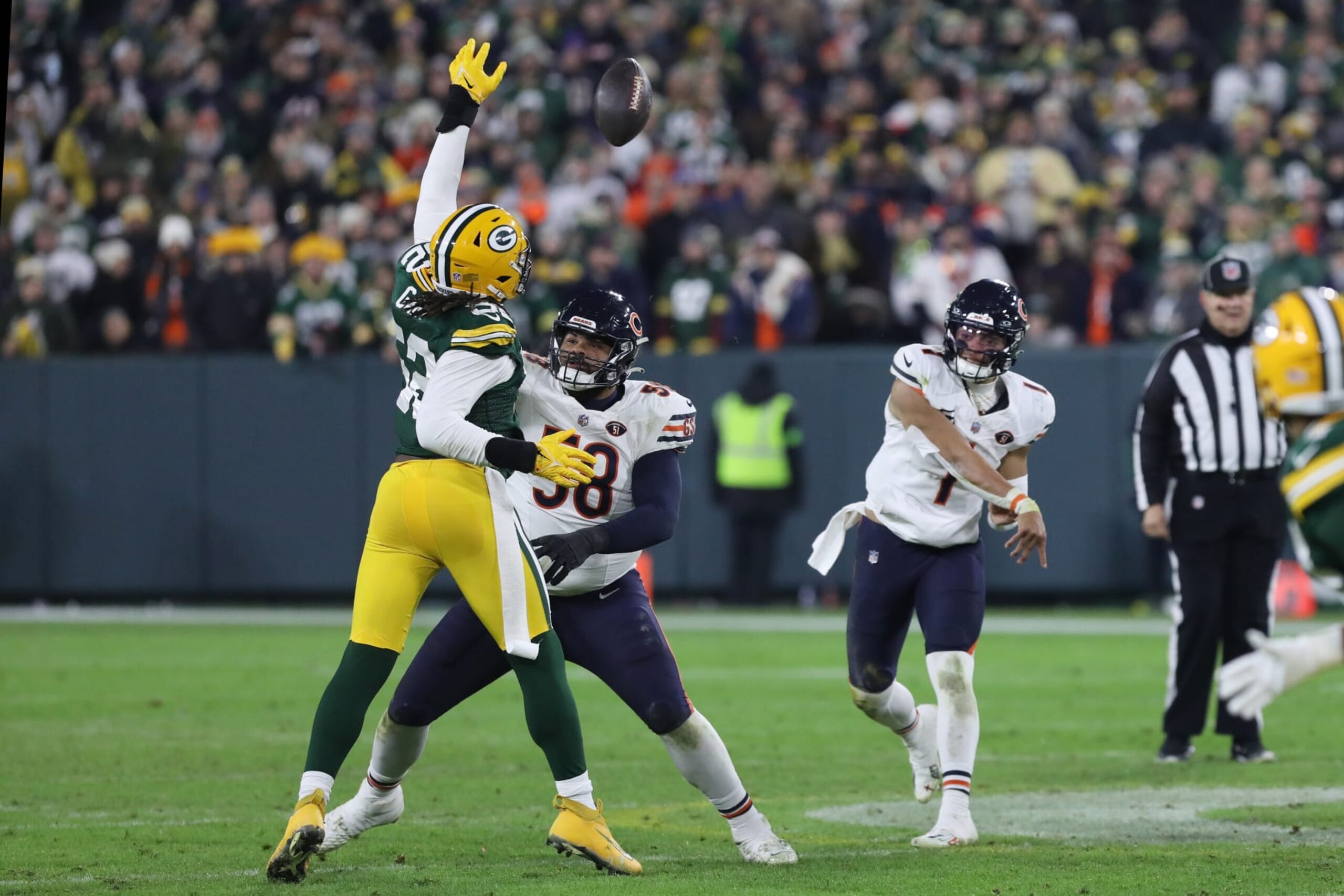 GREEN BAY, WI - JANUARY 07: Green Bay Packers linebacker Rashan Gary (52) tips a Chicago Bears quarterback Justin Fields (1) pass during a game between the Green Bay Packers and the Chicago Bears at Lambeau Field on January 7, 2024 in Green Bay, WI. (Photo by Larry Radloff/Icon Sportswire via Getty Images)