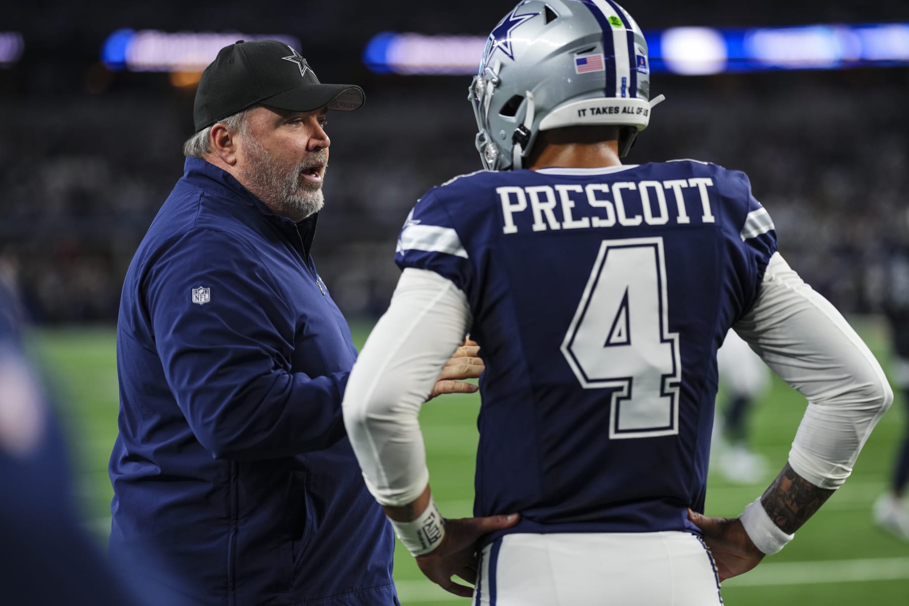 ARLINGTON, TX - DECEMBER 30: Dallas Cowboys head coach Mike McCarthy talks with Dak Prescott #4 prior to an NFL football game against the Detroit Lions at AT&T Stadium on December 30, 2023 in Arlington, Texas. (Photo by Cooper Neill/Getty Images)