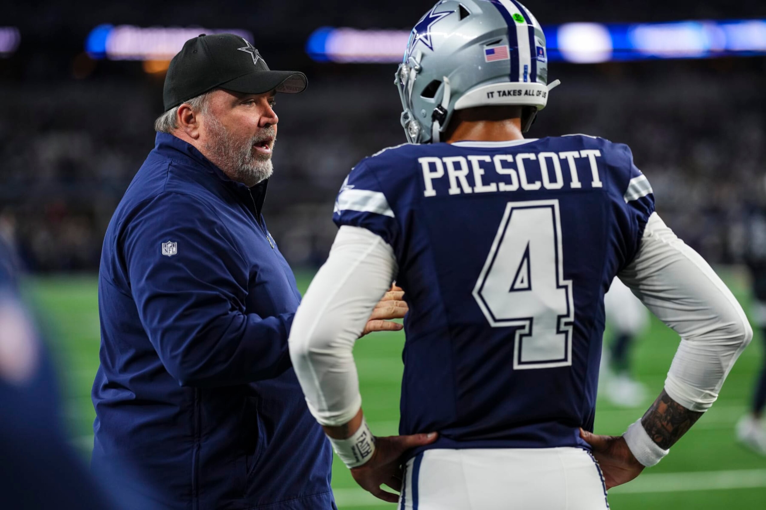 ARLINGTON, TX - DECEMBER 30: Dallas Cowboys head coach Mike McCarthy talks with Dak Prescott #4 prior to an NFL football game against the Detroit Lions at AT&T Stadium on December 30, 2023 in Arlington, Texas. (Photo by Cooper Neill/Getty Images)
