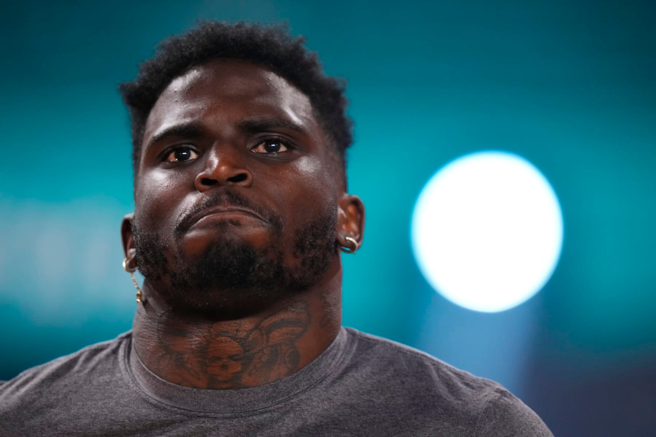 MIAMI GARDENS, FLORIDA - JANUARY 07: Tyreek Hill #10 of the Miami Dolphins warms up prior to a game against the Buffalo Bills at Hard Rock Stadium on January 07, 2024 in Miami Gardens, Florida. (Photo by Rich Storry/Getty Images)