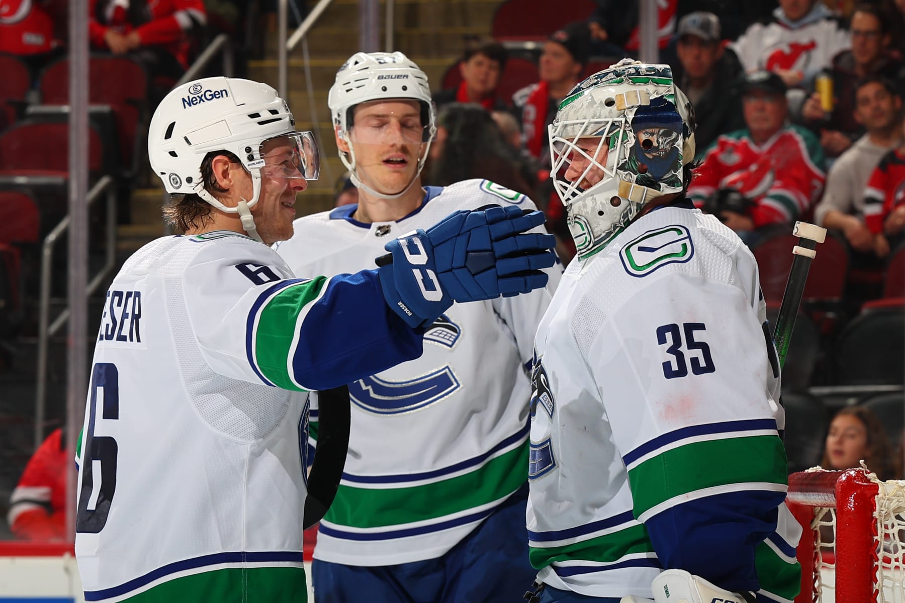 NEWARK, NJ - JANUARY 06:  Thatcher Demko #35 of the Vancouver Canucks celebrates with Brock Boeser #6 after winning the game against the New Jersey Devils at the Prudential Center on January 6, 2024 in Newark, New Jersey.  (Photo by Rich Graessle/NHLI via Getty Images)