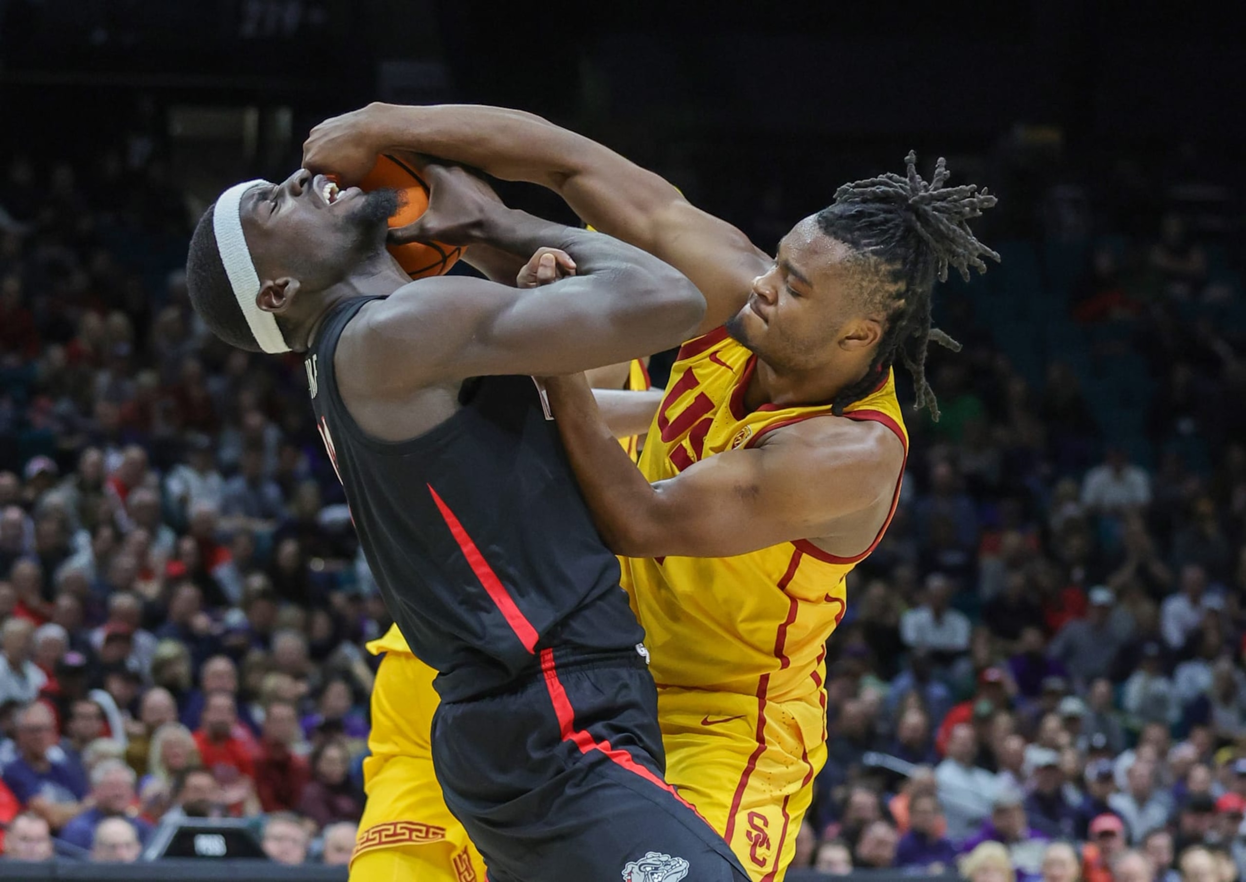 LAS VEGAS, NEVADA - DECEMBER 02: Graham Ike #13 of the Gonzaga Bulldogs and Isaiah Collier #1 of the USC Trojans vie for a loose ball in the second half of their game during the Legends of Basketball Las Vegas Invitational at MGM Grand Garden Arena on December 02, 2023 in Las Vegas, Nevada. A jump ball was called on the play. The Bulldogs defeated the Trojans 89-76. (Photo by Ethan Miller/Getty Images)