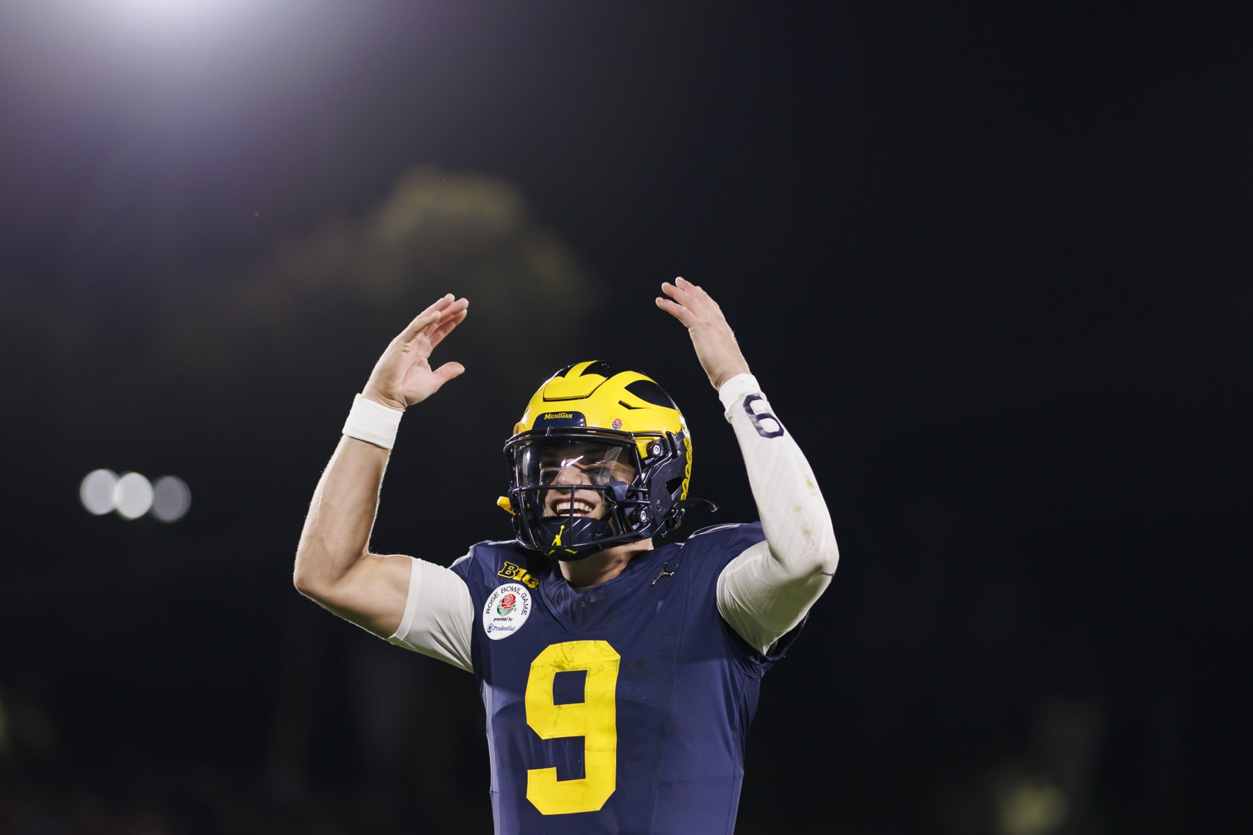 PASADENA, CALIFORNIA - JANUARY 01: Quarterback J.J. McCarthy #9 of the Michigan Wolverines celebrates on the sideline in overtime during the CFP Semifinal Rose Bowl Game against the Alabama Crimson Tide at Rose Bowl Stadium on January 1, 2024 in Pasadena, California. (Photo by Ryan Kang/Getty Images)