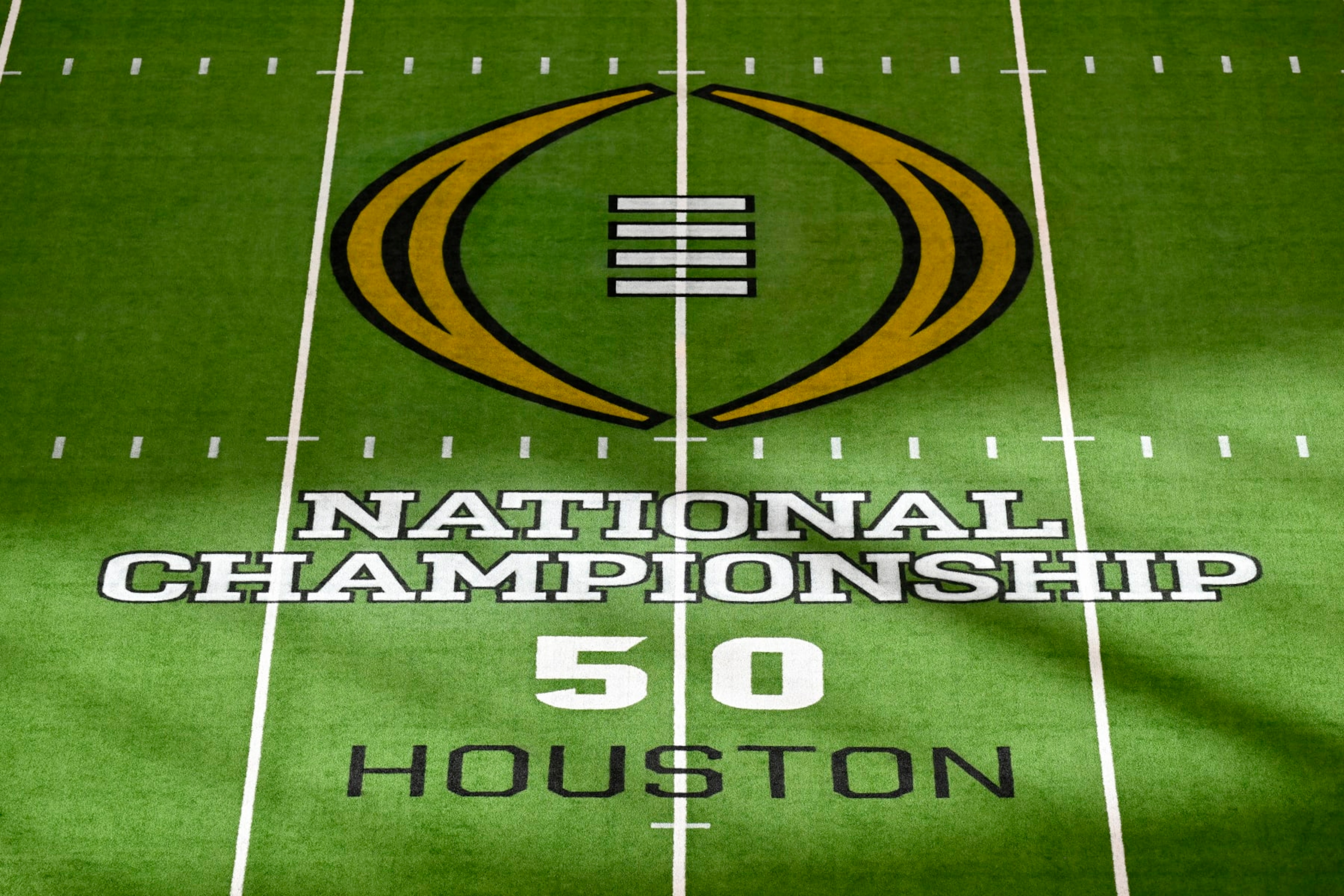 HOUSTON, TEXAS - JANUARY 08: A general view of the field logo before the 2024 CFP National Championship game between the Michigan Wolverines and the Washington Huskies at NRG Stadium on January 08, 2024 in Houston, Texas. (Photo by Alika Jenner/Getty Images) HOUSTON, TEXAS - JANUARY 08: A general view of the field logo before the 2024 CFP National Championship game between the Michigan Wolverines and the Washington Huskies at NRG Stadium on January 08, 2024 in Houston, Texas. (Photo by Alika Jenner/Getty Images)