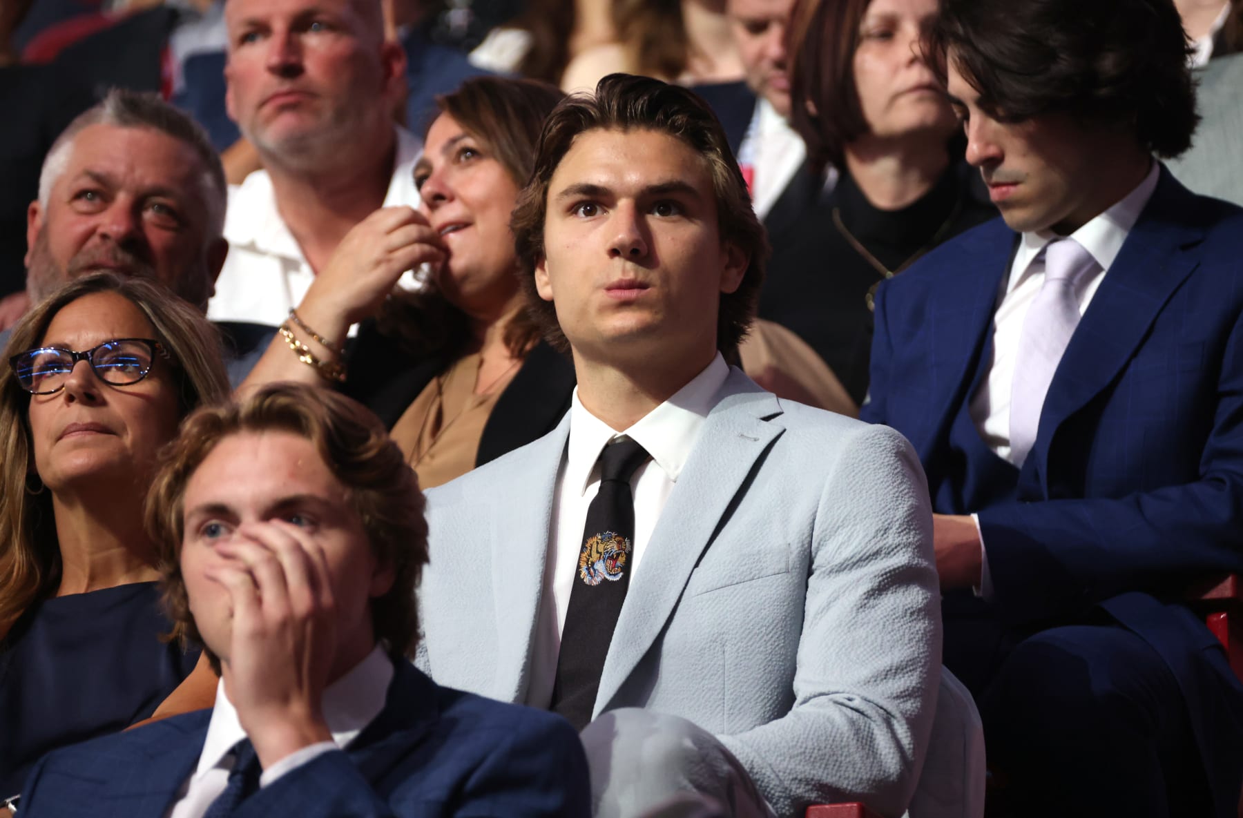 MONTREAL, QUEBEC - JULY 07: NHL prospect Cutter Gauthier looks on from his seat during the first round of the 2022 Upper Deck NHL Draft at Bell Centre on July 07, 2022 in Montreal, Quebec. (Photo by Dave Sandford/NHLI via Getty Images)