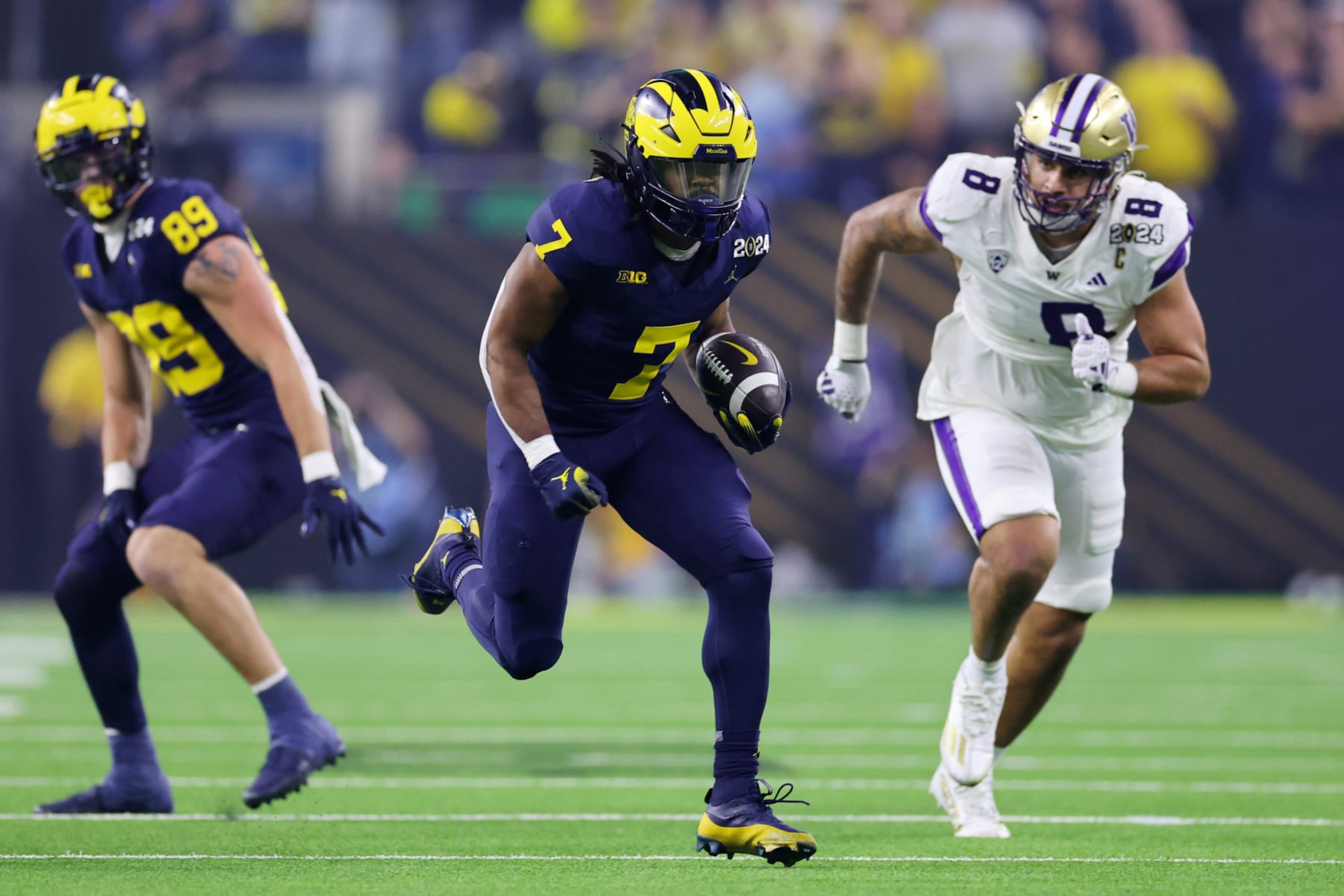 HOUSTON, TEXAS - JANUARY 08: Donovan Edwards #7 of the Michigan Wolverines runs the ball for a touchdown in the first quarter against the Washington Huskies during the 2024 CFP National Championship game at NRG Stadium on January 08, 2024 in Houston, Texas. (Photo by Stacy Revere/Getty Images) HOUSTON, TEXAS - JANUARY 08: Donovan Edwards #7 of the Michigan Wolverines runs the ball for a touchdown in the first quarter against the Washington Huskies during the 2024 CFP National Championship game at NRG Stadium on January 08, 2024 in Houston, Texas. (Photo by Stacy Revere/Getty Images)