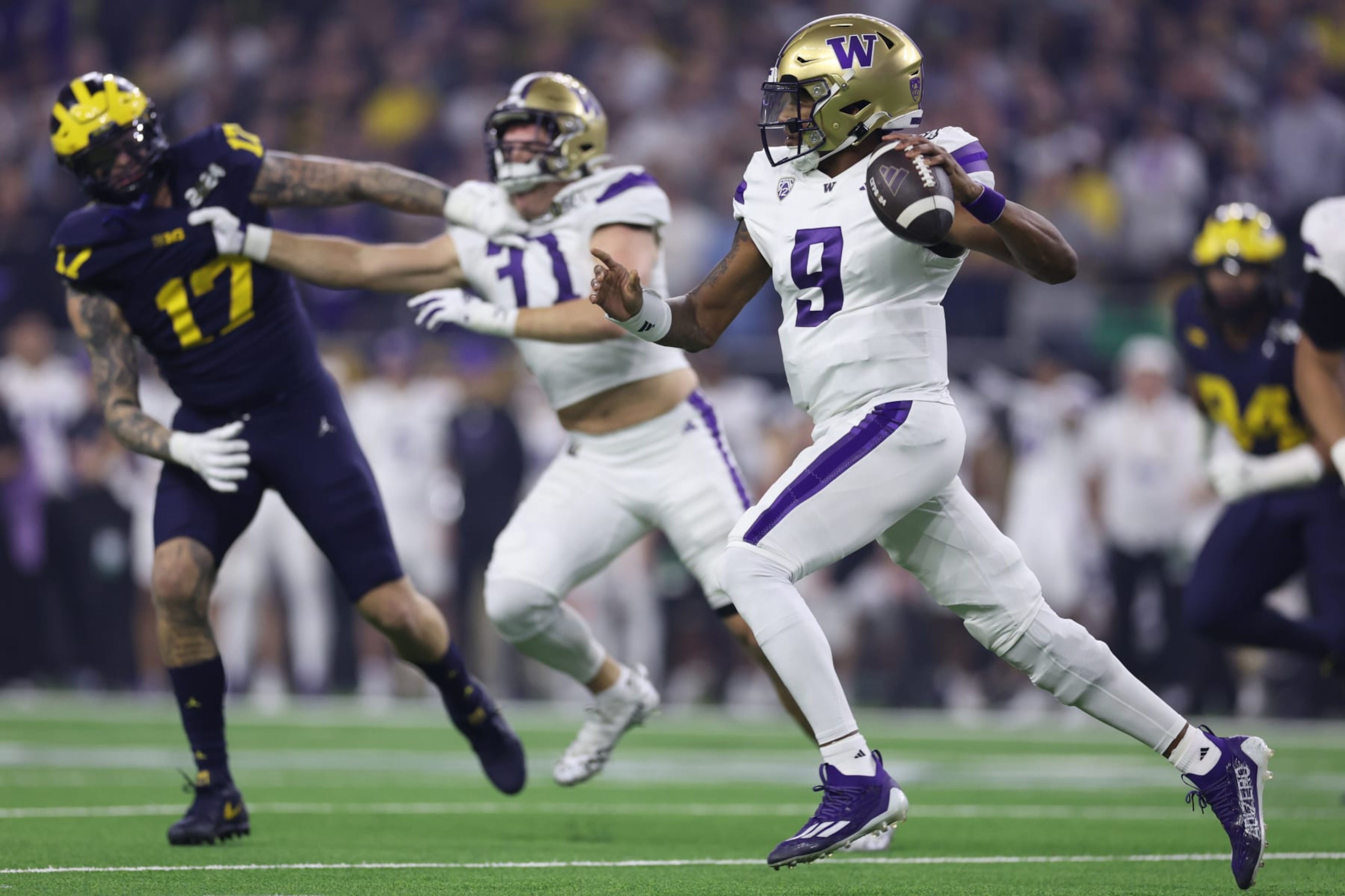 HOUSTON, TEXAS - JANUARY 08: Michael Penix Jr. #9 of the Washington Huskies throws the ball in the first quarter against the Michigan Wolverines during the 2024 CFP National Championship game at NRG Stadium on January 08, 2024 in Houston, Texas. (Photo by Maddie Meyer/Getty Images) HOUSTON, TEXAS - JANUARY 08: Michael Penix Jr. #9 of the Washington Huskies throws the ball in the first quarter against the Michigan Wolverines during the 2024 CFP National Championship game at NRG Stadium on January 08, 2024 in Houston, Texas. (Photo by Maddie Meyer/Getty Images)
