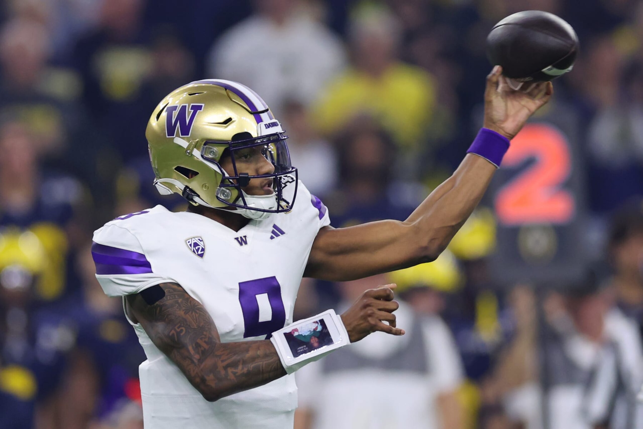 HOUSTON, TEXAS - JANUARY 08: Michael Penix Jr. #9 of the Washington Huskies throws the ball in the first quarter against the Michigan Wolverines during the 2024 CFP National Championship game at NRG Stadium on January 08, 2024 in Houston, Texas. (Photo by Stacy Revere/Getty Images) HOUSTON, TEXAS - JANUARY 08: Michael Penix Jr. #9 of the Washington Huskies throws the ball in the first quarter against the Michigan Wolverines during the 2024 CFP National Championship game at NRG Stadium on January 08, 2024 in Houston, Texas. (Photo by Stacy Revere/Getty Images)