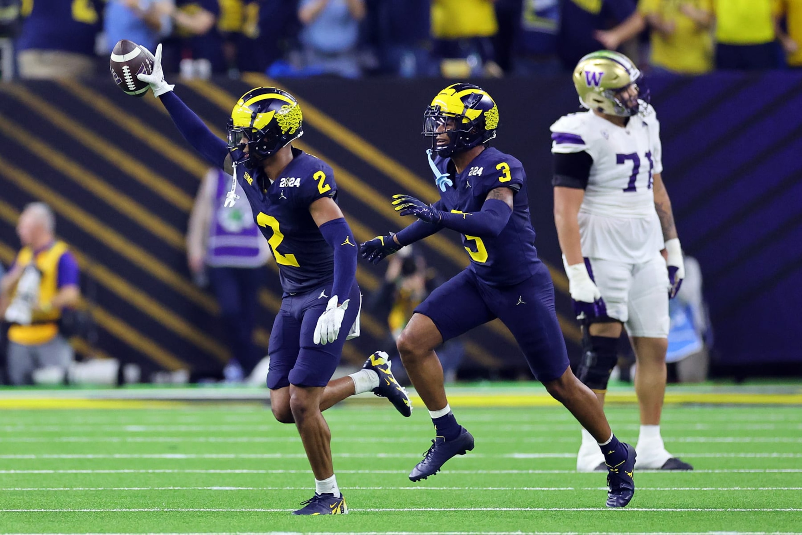 HOUSTON, TEXAS - JANUARY 08: Will Johnson #2 of the Michigan Wolverines celebrates after intercepting a pass in the third quarter against the Washington Huskies during the 2024 CFP National Championship game at NRG Stadium on January 08, 2024 in Houston, Texas. (Photo by Stacy Revere/Getty Images)