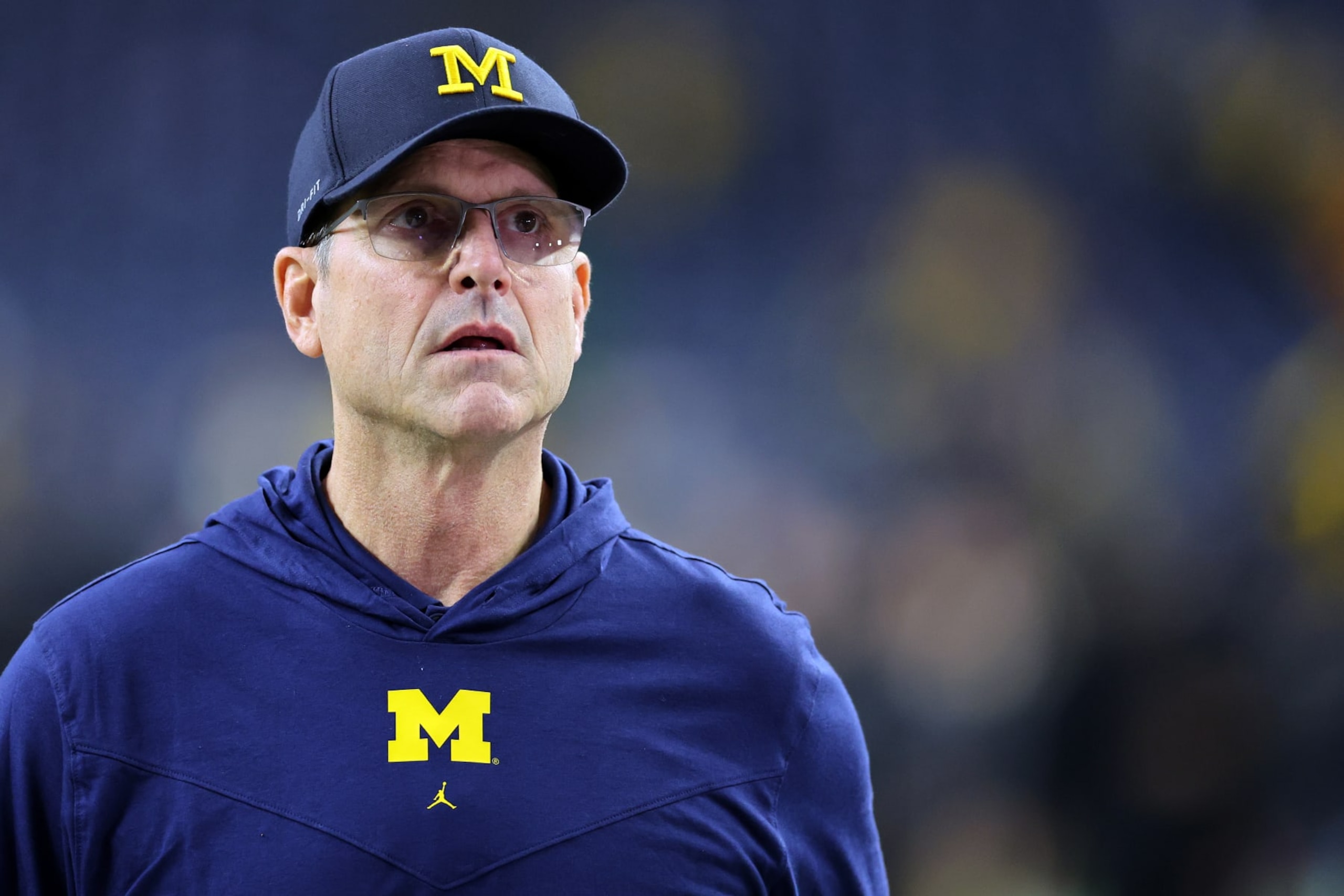 HOUSTON, TEXAS - JANUARY 08: Head coach Jim Harbaugh of the Michigan Wolverines looks on prior to the 2024 CFP National Championship game against the Washington Huskies at NRG Stadium on January 08, 2024 in Houston, Texas. (Photo by Stacy Revere/Getty Images)