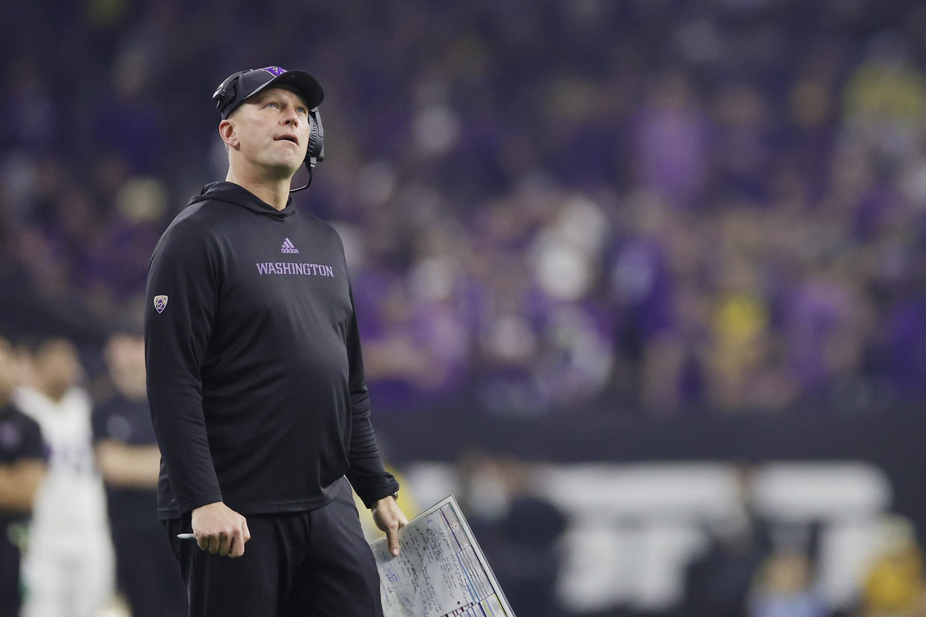 HOUSTON, TEXAS - JANUARY 08: Head coach Kalen DeBoer of the Washington Huskies looks on in the first half against the Michigan Wolverines during the 2024 CFP National Championship game at NRG Stadium on January 08, 2024 in Houston, Texas. (Photo by Carmen Mandato/Getty Images)
