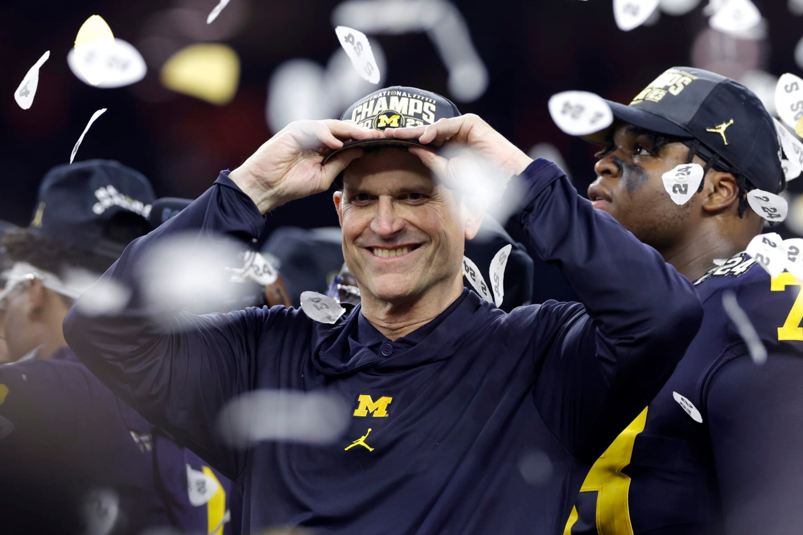 HOUSTON, TEXAS - JANUARY 08: Head coach Jim Harbaugh of the Michigan Wolverines reacts after defeating the Washington Huskies during the 2024 CFP National Championship game at NRG Stadium on January 08, 2024 in Houston, Texas. Michigan defeated Washington 34-13. (Photo by Carmen Mandato/Getty Images)