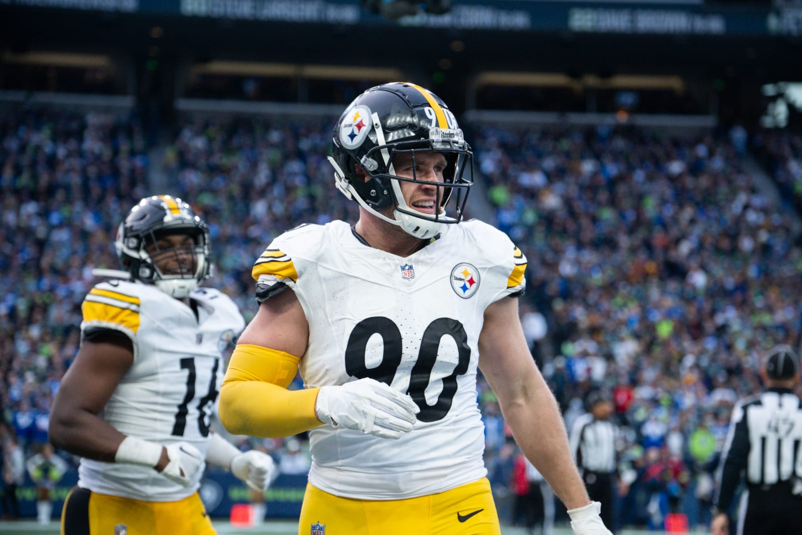 SEATTLE, WASHINGTON - DECEMBER 31: T.J. Watt #90 of the Pittsburgh Steelers runs back to the sideline after celebrating a fumble recovery at Lumen Field on December 31, 2023 in Seattle, Washington. (Photo by Conor Courtney/Getty Images)
