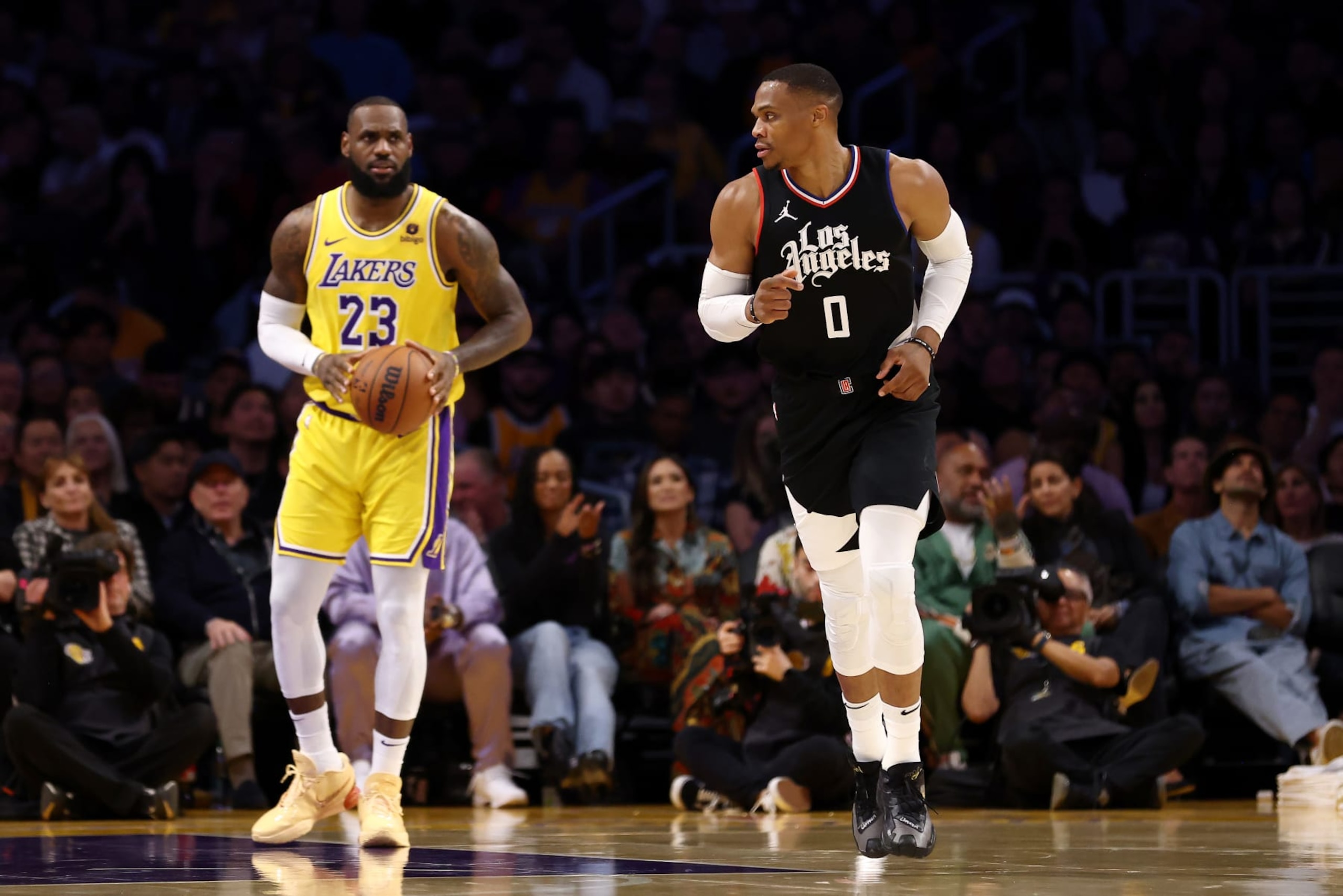 LOS ANGELES, CALIFORNIA - NOVEMBER 01: Russell Westbrook #0 of the Los Angeles Clippers looks on after scoring as LeBron James #23 of the Los Angeles Lakers inbounds the ball during the second quarter at Crypto.com Arena on November 01, 2023 in Los Angeles, California. NOTE TO USER: User expressly acknowledges and agrees that, by downloading and or using this photograph, User is consenting to the terms and conditions of the Getty Images License Agreement. (Photo by Katelyn Mulcahy/Getty Images) LOS ANGELES, CALIFORNIA - NOVEMBER 01: Russell Westbrook #0 of the Los Angeles Clippers looks on after scoring as LeBron James #23 of the Los Angeles Lakers inbounds the ball during the second quarter at Crypto.com Arena on November 01, 2023 in Los Angeles, California. NOTE TO USER: User expressly acknowledges and agrees that, by downloading and or using this photograph, User is consenting to the terms and conditions of the Getty Images License Agreement. (Photo by Katelyn Mulcahy/Getty Images)