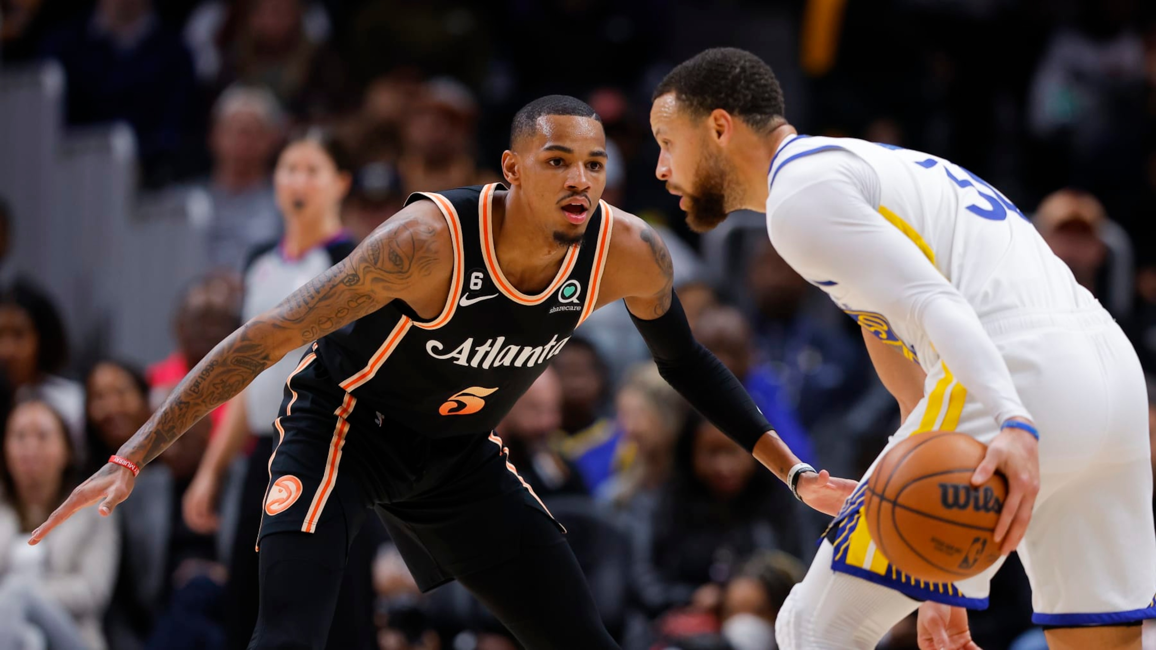 ATLANTA, GA - MARCH 17: Dejounte Murray #5 of the Atlanta Hawks defends against Stephen Curry #30 of the Golden State Warriors during the first half at State Farm Arena on March 17, 2023 in Atlanta, Georgia. NOTE TO USER: User expressly acknowledges and agrees that, by downloading and or using this photograph, User is consenting to the terms and conditions of the Getty Images License Agreement. (Photo by Todd Kirkland/Getty Images) ATLANTA, GA - MARCH 17: Dejounte Murray #5 of the Atlanta Hawks defends against Stephen Curry #30 of the Golden State Warriors during the first half at State Farm Arena on March 17, 2023 in Atlanta, Georgia. NOTE TO USER: User expressly acknowledges and agrees that, by downloading and or using this photograph, User is consenting to the terms and conditions of the Getty Images License Agreement. (Photo by Todd Kirkland/Getty Images)