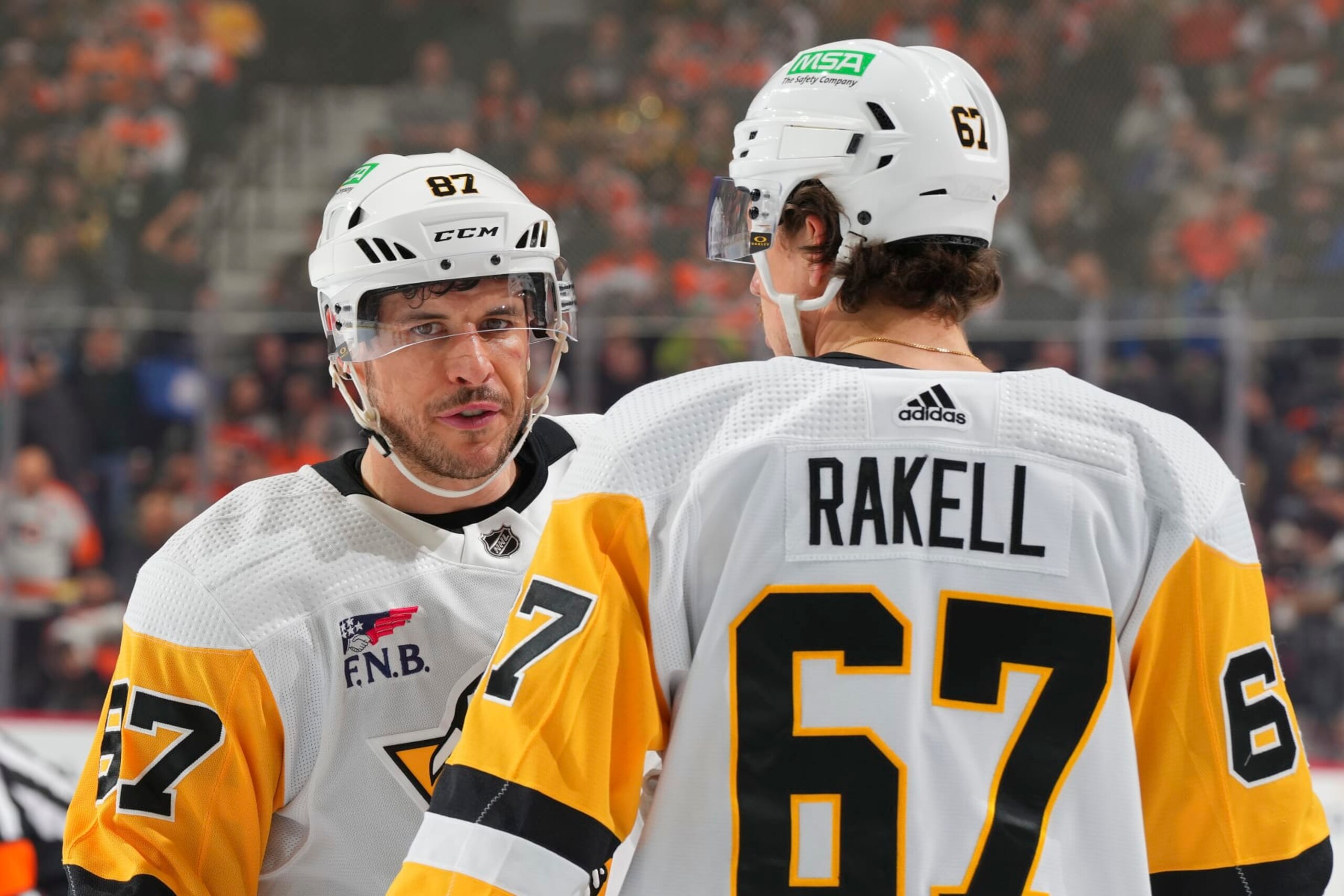 PHILADELPHIA, PENNSYLVANIA - JANUARY 8: Sidney Crosby #87 of the Pittsburgh Penguins talks to Rickard Rakell #67 against the Philadelphia Flyers at the Wells Fargo Center on January 8, 2024 in Philadelphia, Pennsylvania. (Photo by Mitchell Leff/Getty Images) PHILADELPHIA, PENNSYLVANIA - JANUARY 8: Sidney Crosby #87 of the Pittsburgh Penguins talks to Rickard Rakell #67 against the Philadelphia Flyers at the Wells Fargo Center on January 8, 2024 in Philadelphia, Pennsylvania. (Photo by Mitchell Leff/Getty Images)